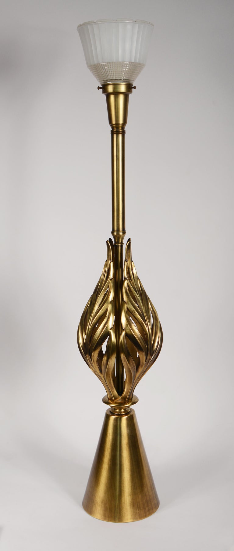 Brass table lamp with stylized acanthus or philodendron leaves by Rembrandt Lamps. This lamp has a three-way switch at the socket and a simple on off switch on the base. The original shade dropped down almost to the top of the leaves making the