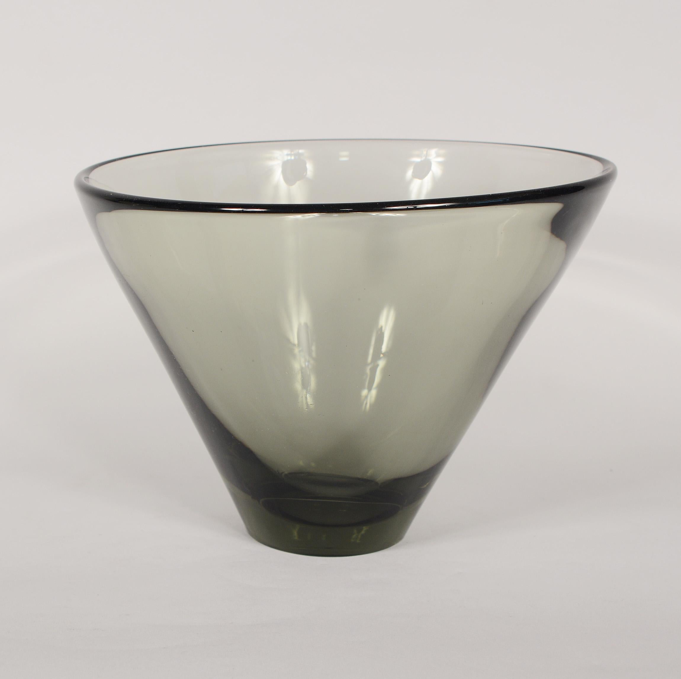 Tall flaring bowl designed by Per Lutken for Holmegaard. The bowl has a small chip on the base and a small ding on the side.