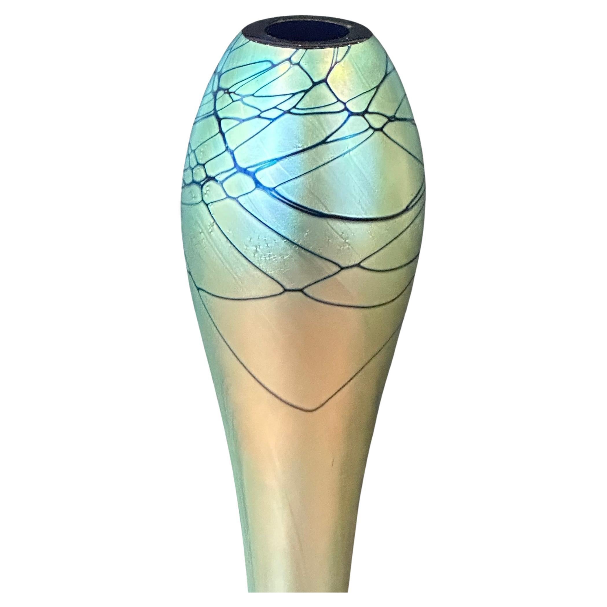 Gorgeous tall iridescent art glass bud vase by Steven Maslach, circa 1989.  This vase is in very good vintage condition with no chips or cracks and measures 3.375