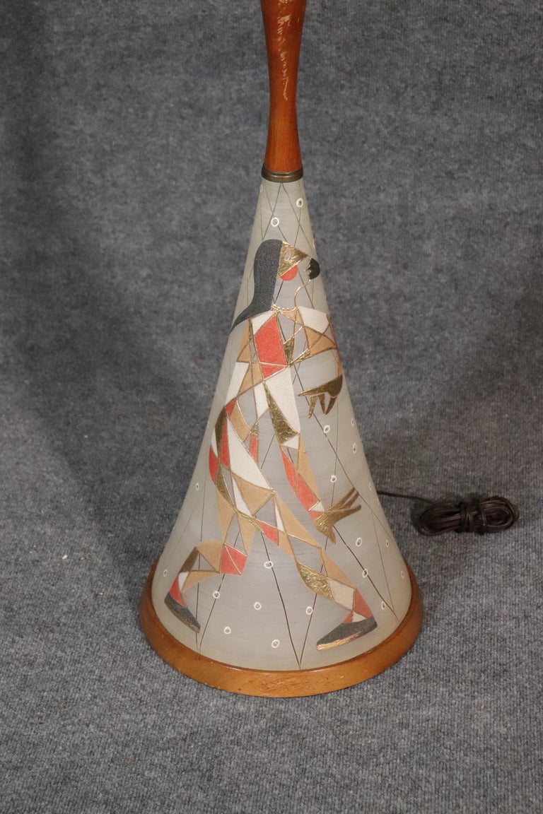This is a gorgeous lamp in very good condition with no damage or issues, circa 1950s. The lamp measures: 47 tall x 13 wide x 13 deep.