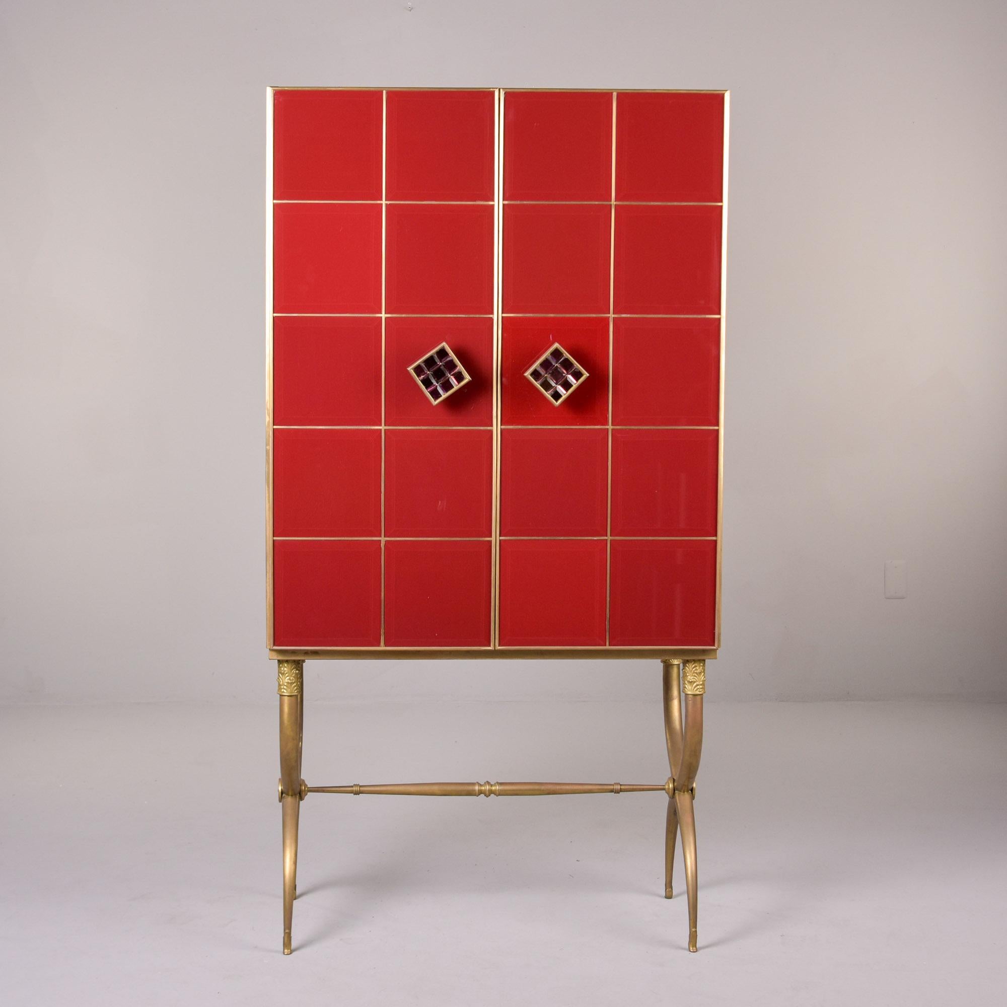 Hollywood Regency Tall Italian Mid Century Red Glass and Brass Bar Cabinet For Sale
