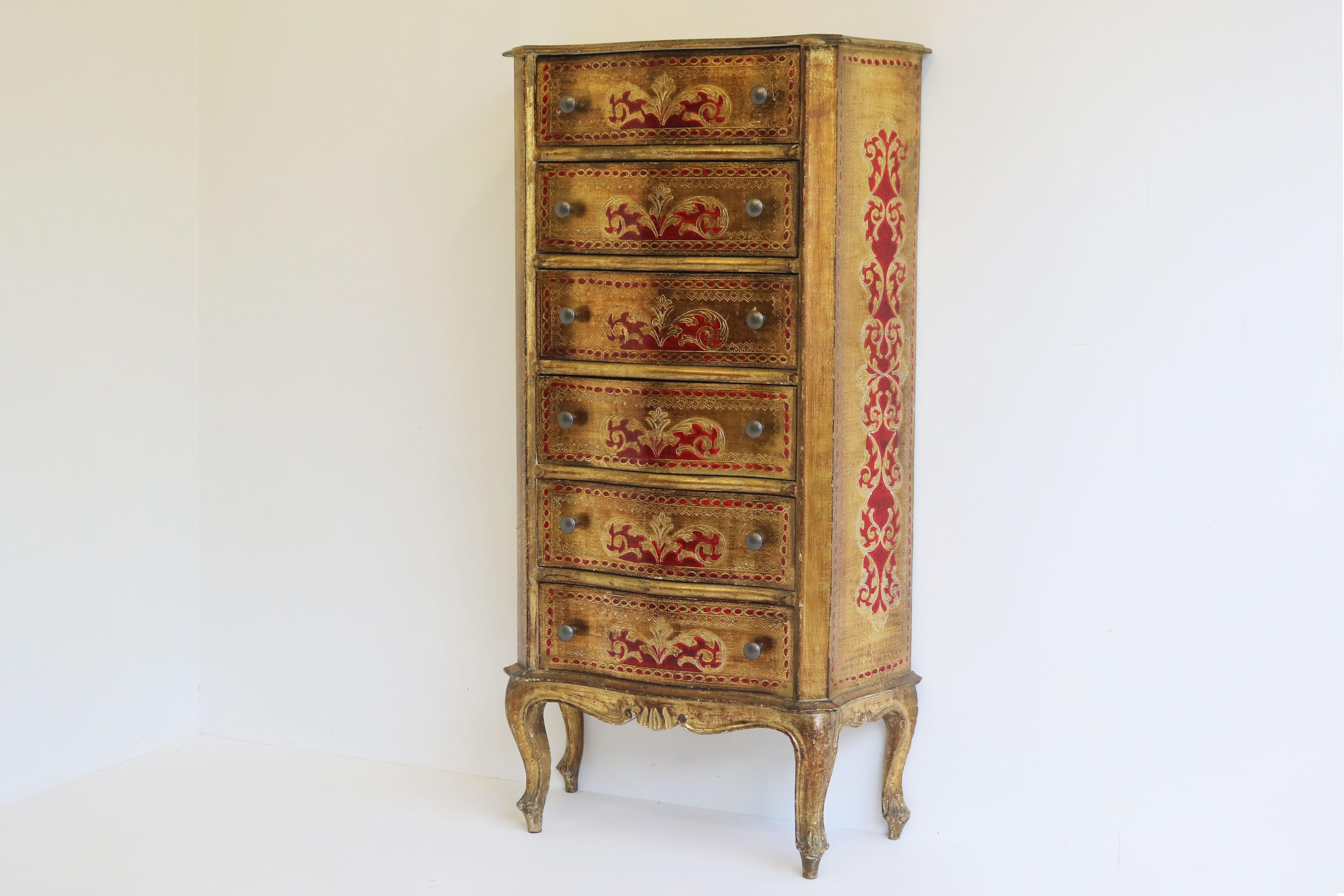 Gorgeous Italian Florentine style tall chest of six drawers. Gorgeous gold wood with painted red accents. The curved serpentine legs give an old italian renaaissance touch and are very chic. The piece has bent wood sides and curved wood drawers