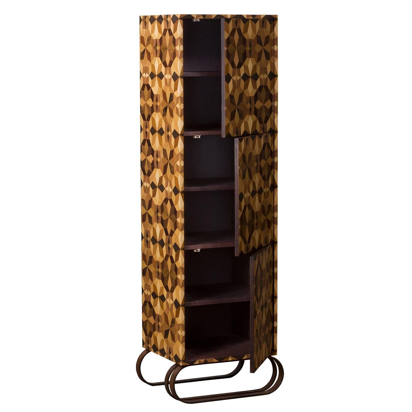 This tall cabinet features three doors with a shelf behind each one. This exquisite piece has a multi-layer poplar structure and is decorated entirely by hand on top using an ancient inlaid wood technique. The natural tone of the wood is enhanced by