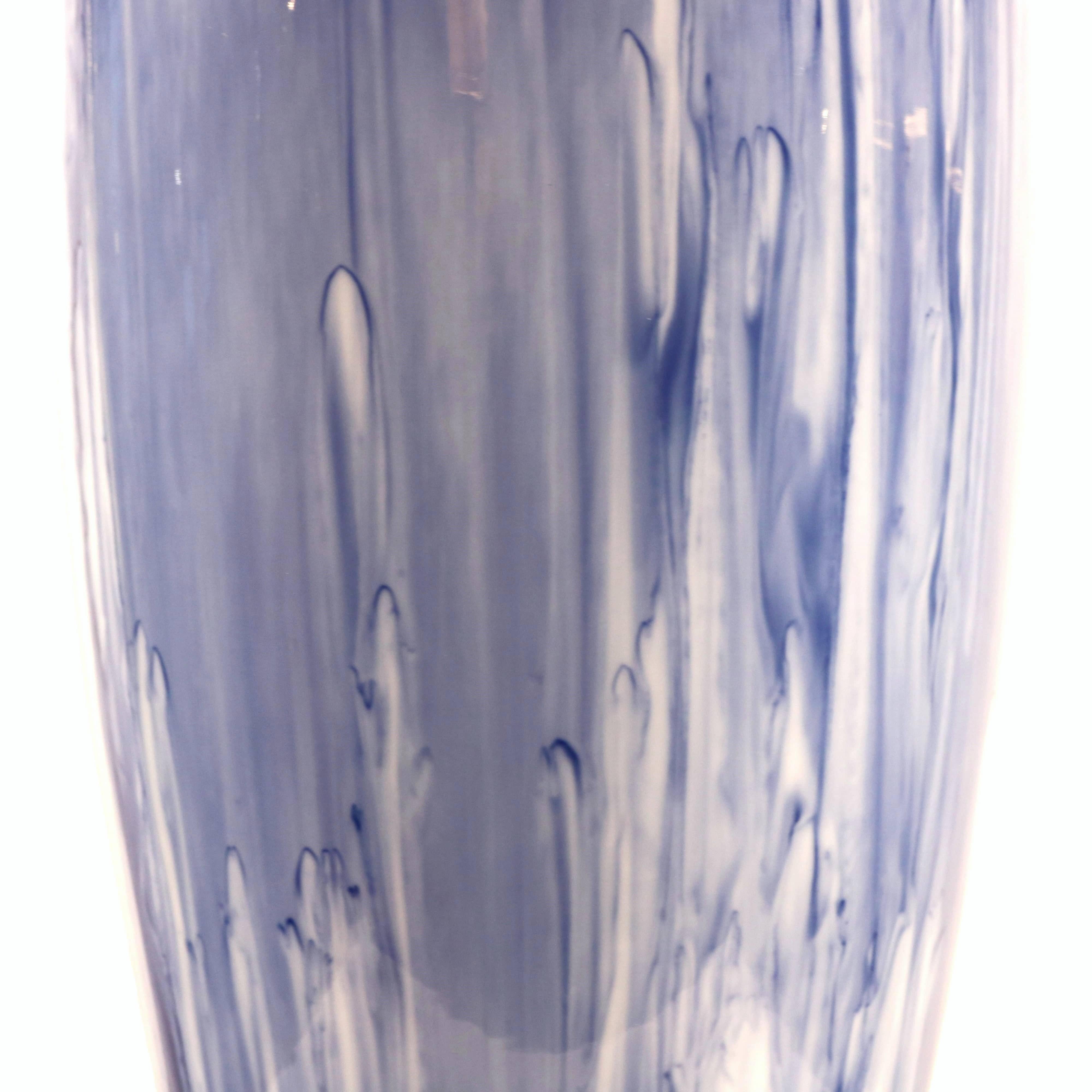 A KPM designed tall porcelain vase with blue drip glaze from Germany circa 1970. One of Germany’s oldest and finest porcelain factories, KPM is headquartered in Berlin and has created exceptional pieces since 1763.