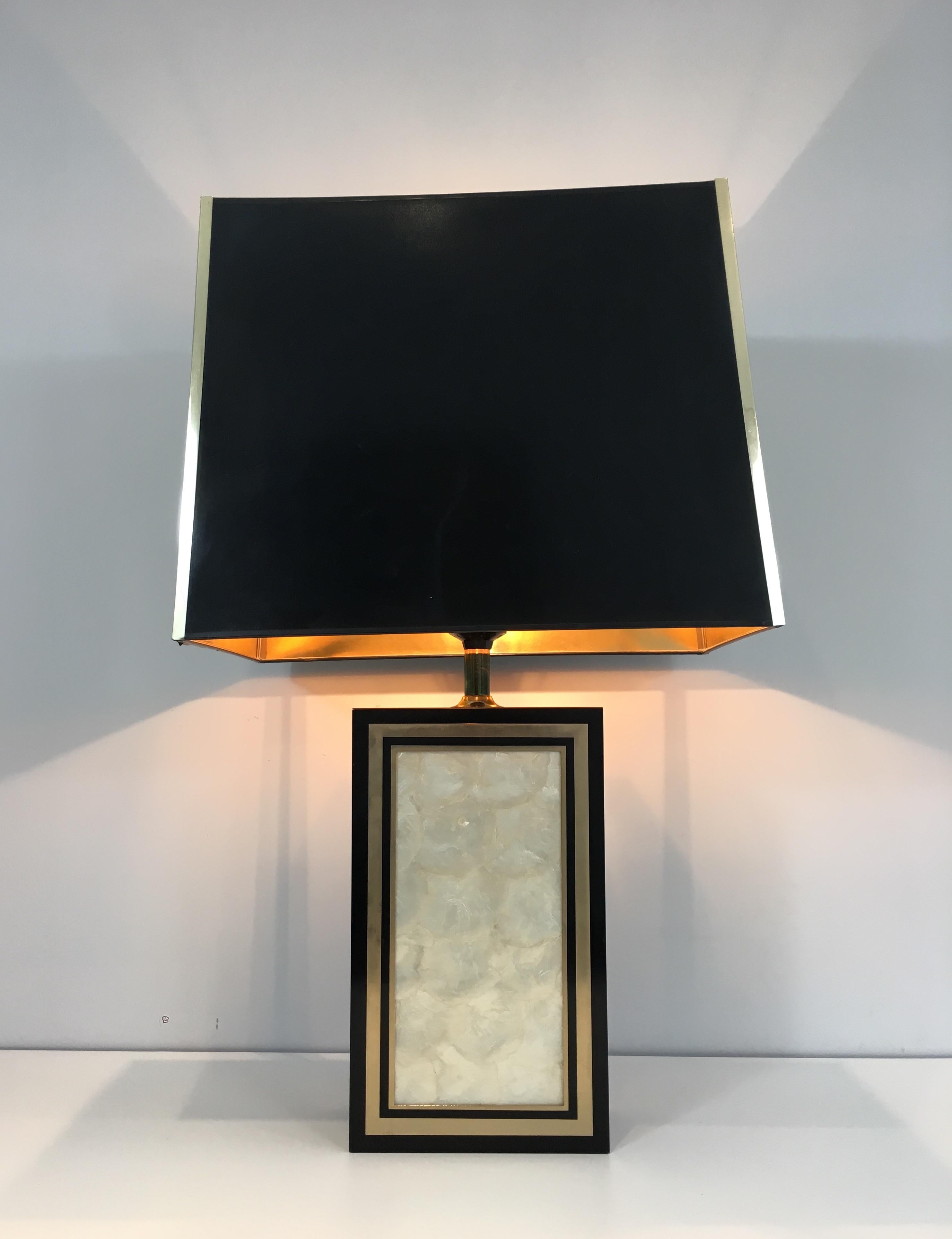 This very nice and important table lamp is made of black lacquered wood gild and mother of pearl. This is a French, circa 1970.
