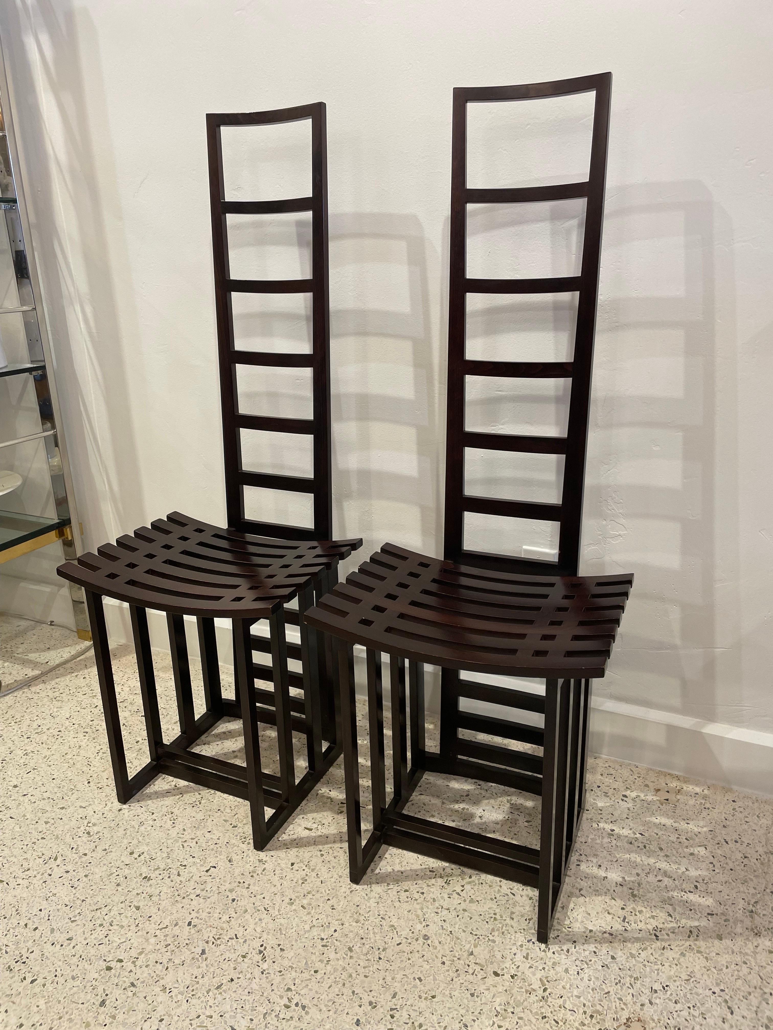 Extremely stylish and architectural designed ladder back chairs in a rich ebonized wood.