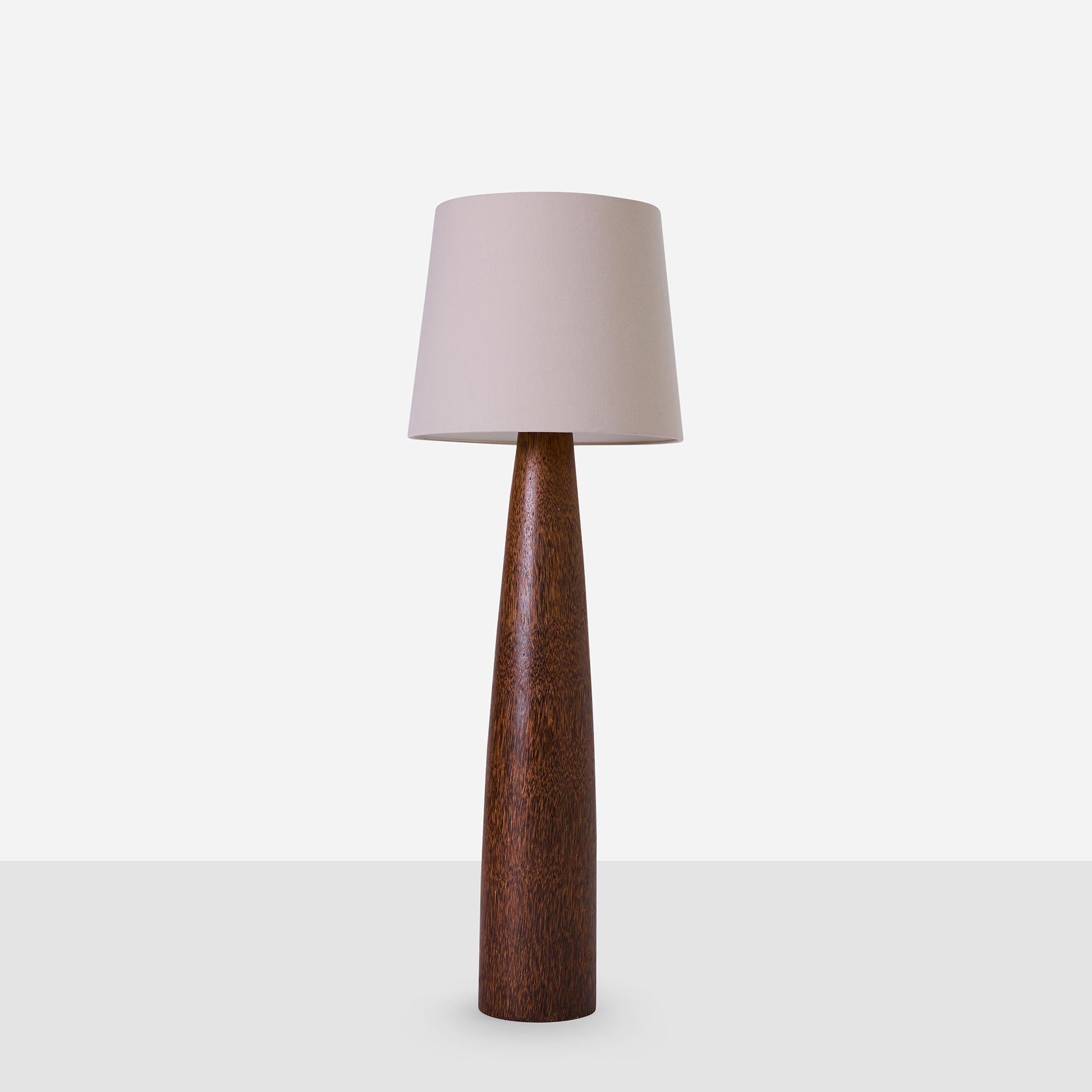 Tall palm wood base floor lamp from the iconic Hollywood Prop House, renowned for craftsmanship and creating pieces built to last. The wood base has been professionally restored and fitted with a new E26 socket. Wired for US. Retains original cord