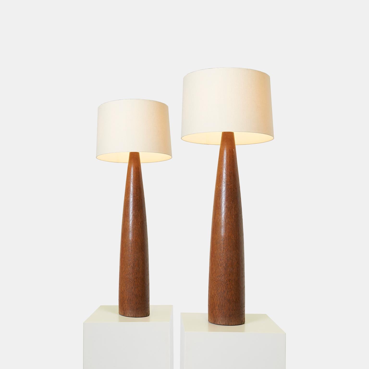 A pair of tall palm wood lamps from the iconic Hollywood Prop House which had a reputation for craftsmanship and creating pieces that were built to last.

Marked on the base 