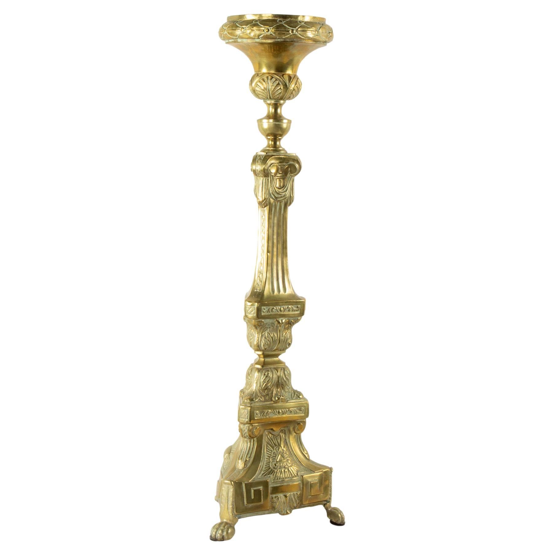 Originally used in a French chapel, this exquisite brass repousse pricket or candlestick from the late nineteenth century stands at over two and a half feet tall and features intricate detailing of acanthus leaves and laurels, as well as geometric