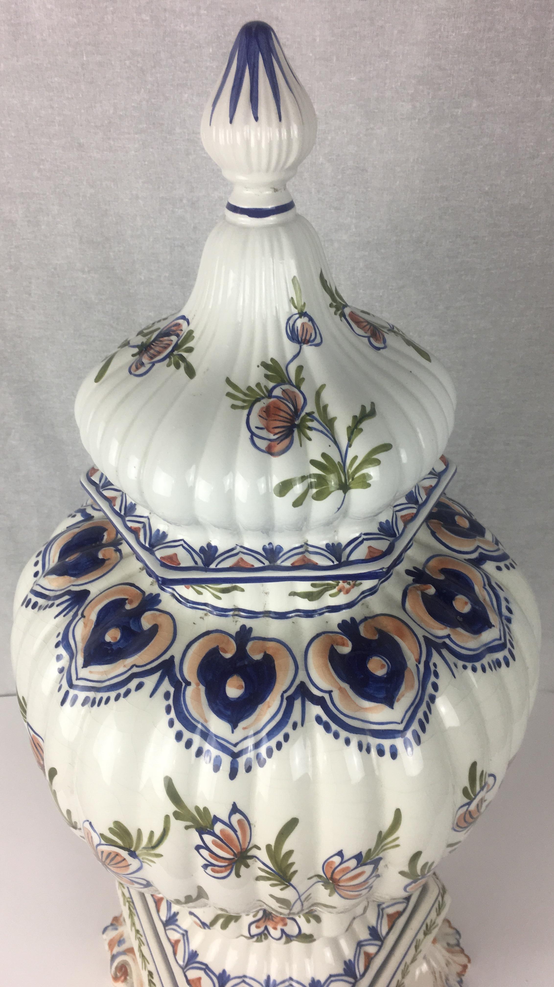 A fine late 19th French hand painted Faience centerpiece. 

The elegant floral motif is truly stunning and will enhance any foyer guerdon, console or dining room tabletop. This antique item is made up of 3 parts with its lid, center and bottom.