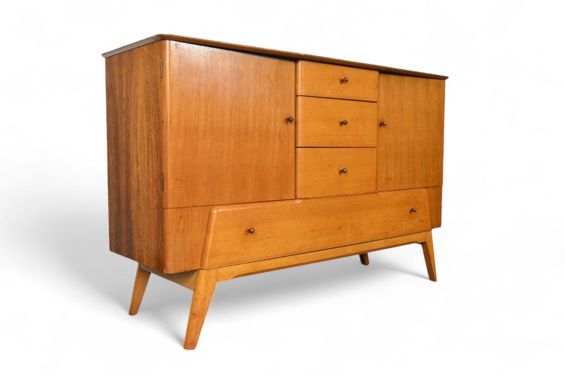 Origin: England
Designer: Unknown
Manufacturer: Lebus Link
Era: 1960s
Materials: Mahogany, Birch
Measurements: 55.5