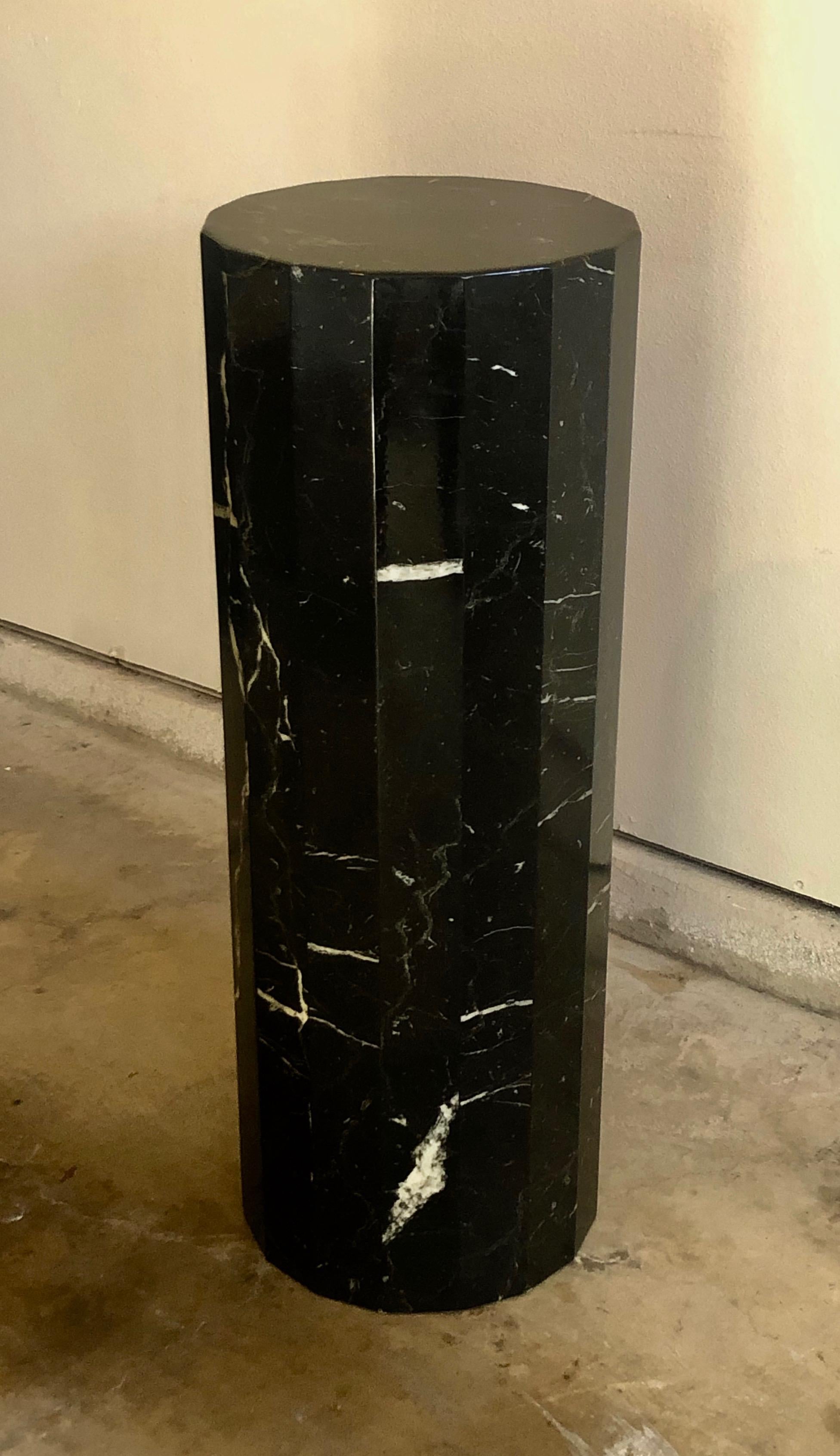 Tall black stone pedestal/ column. Perfect to place one of your favorite sculpture or plant on top of. Beautiful veining in the stone. This can go with really any kind of decor style!