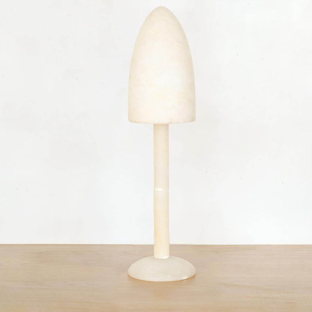 Tall creamy marble table lamp from Spain, 1960's. Solid circular base, thin stem with bullet shaped shade. Shade is removable to access bulb. Modern shape with beautiful grains in stone. Newly re-wired.