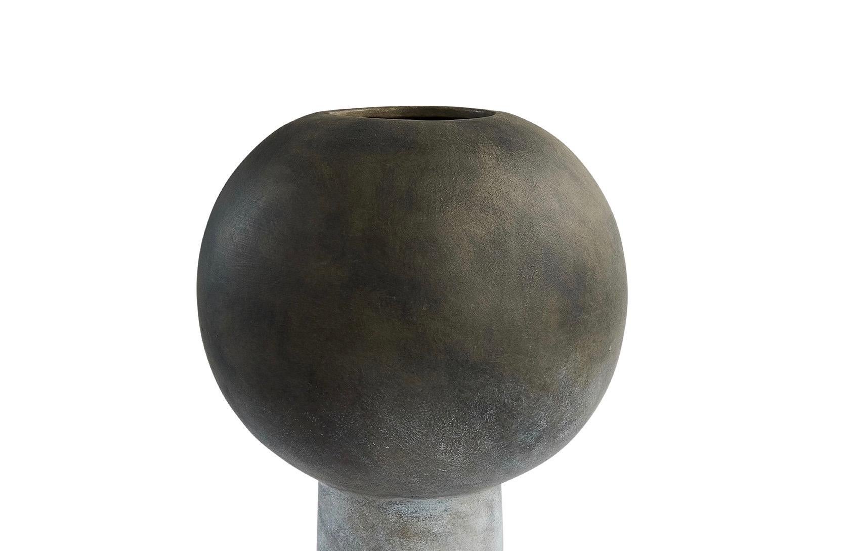 Contemporary Danish design tall matte grey ceramic vase.
Globe shaped top with single tubular base.
Smaller version available S5613
Two available and sold individually.
