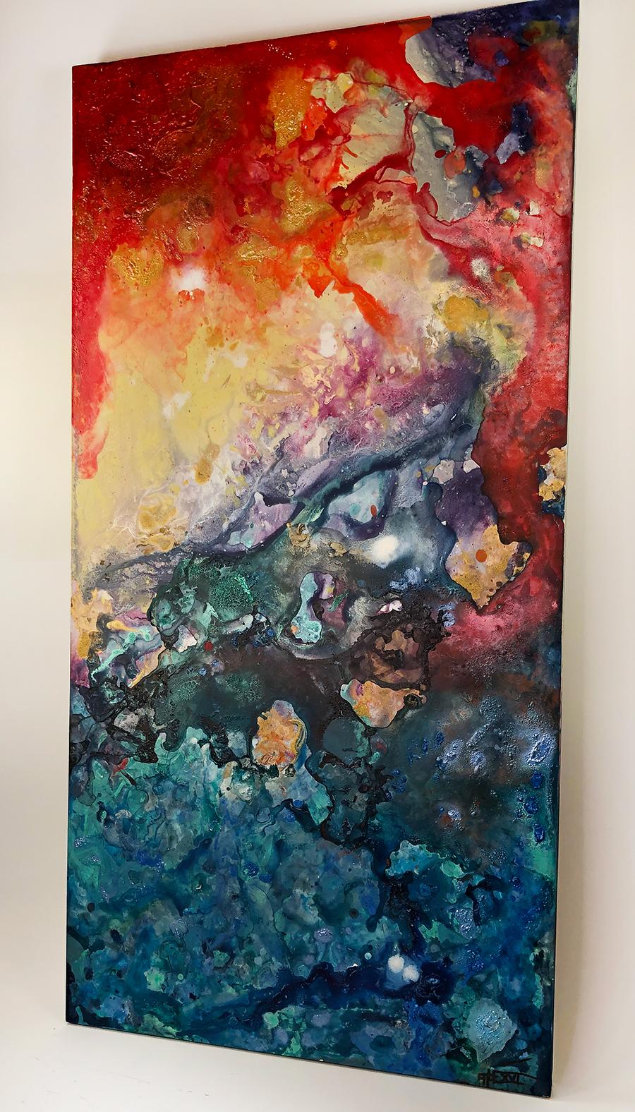A medium scale abstract painting on panel by artist Cabe Booth. This acrylic pour piece contrasts deep warm blue colors with fiery intense yellows and oranges. This piece gives you the feeling of being caught in an intense tidal wave at sunset. The