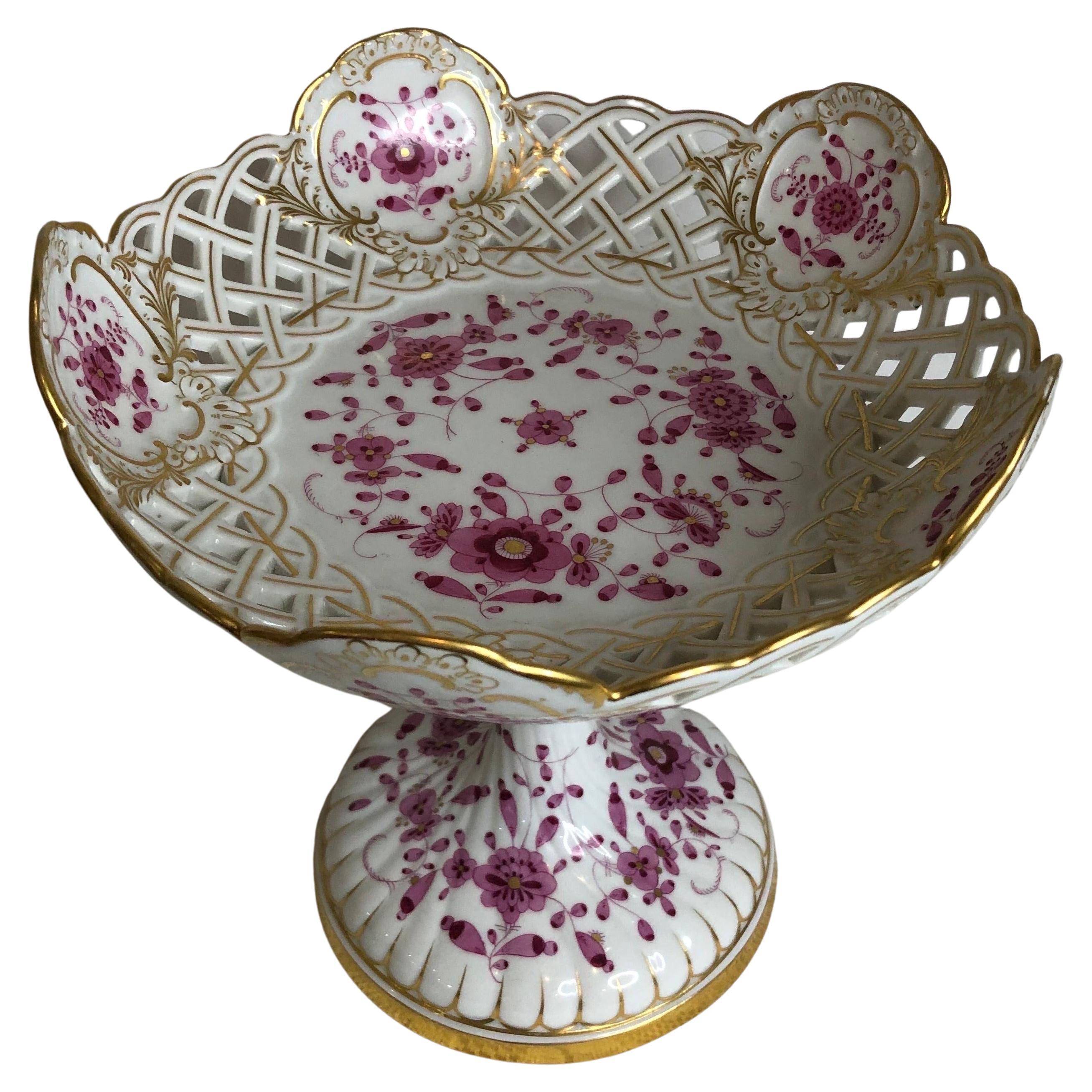 This tall Meissen reticulated purple Indian compote is very rare and extremely hard to find. It is a beautiful serving compote or decoration for your table, your sideboard or your cabinet. It would make a stunning addition to any table setting.