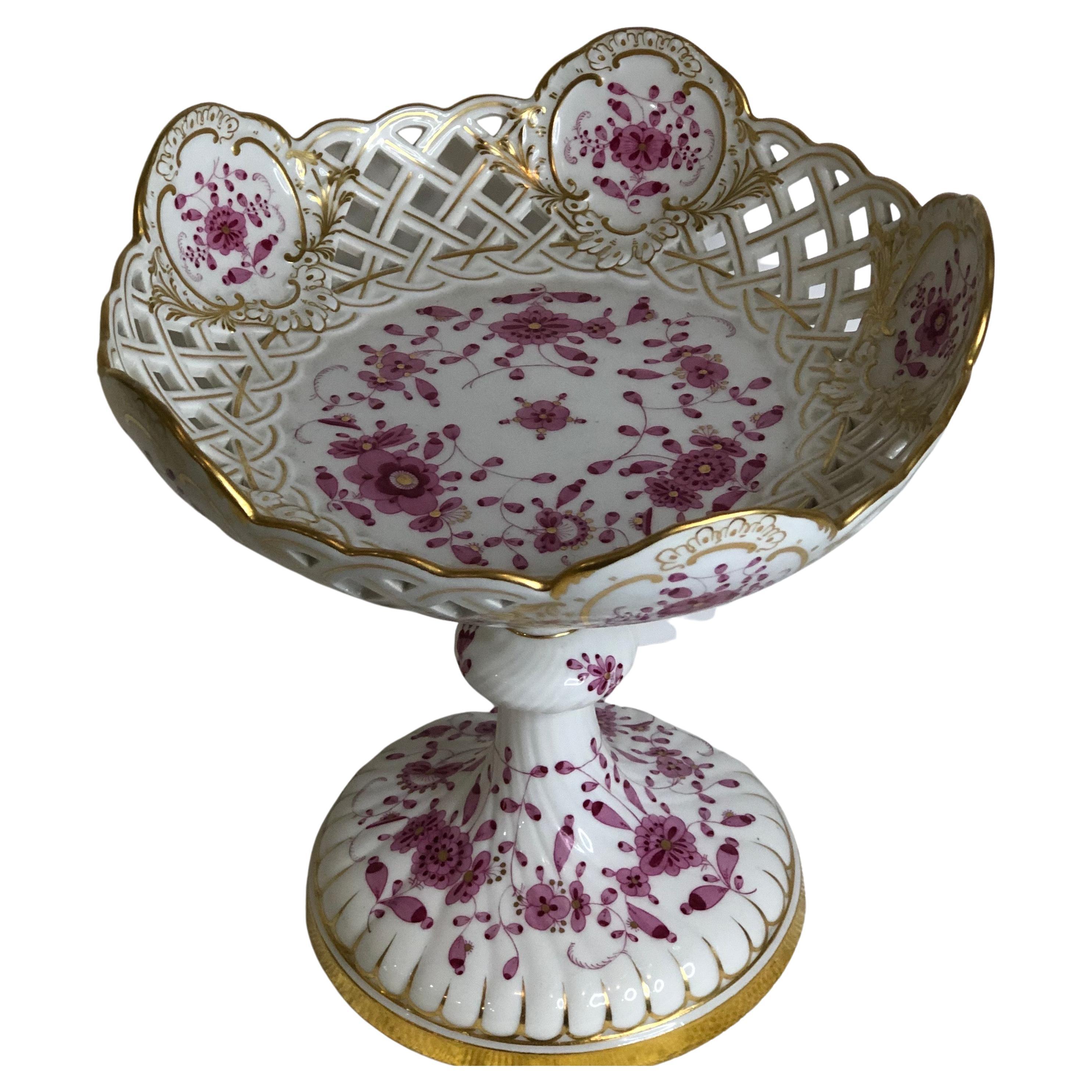This tall Meissen reticulated purple Indian compote is very rare and extremely hard to find. It is a beautiful serving compote or decoration for your table, your sideboard or your cabinet. It would make a stunning addition to any table setting.