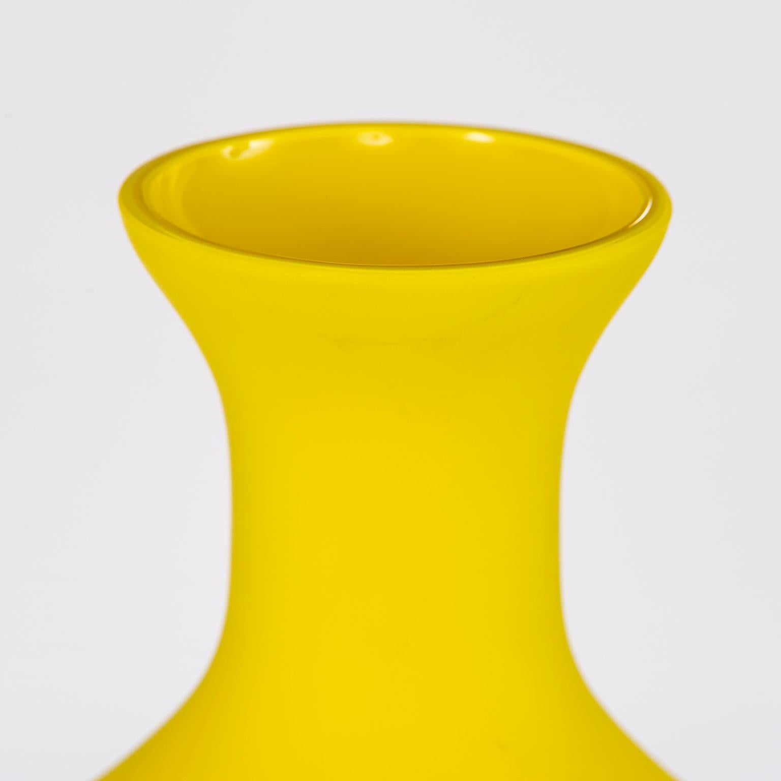 Classic form Murano glass vase attributed to Cenedese, circa 1970s. (We acquired other signed Cenedese pieces in other colors in this shape/style) Matte finish daffodil yellow color and stands 12” high. Excellent vintage condition with no flaws