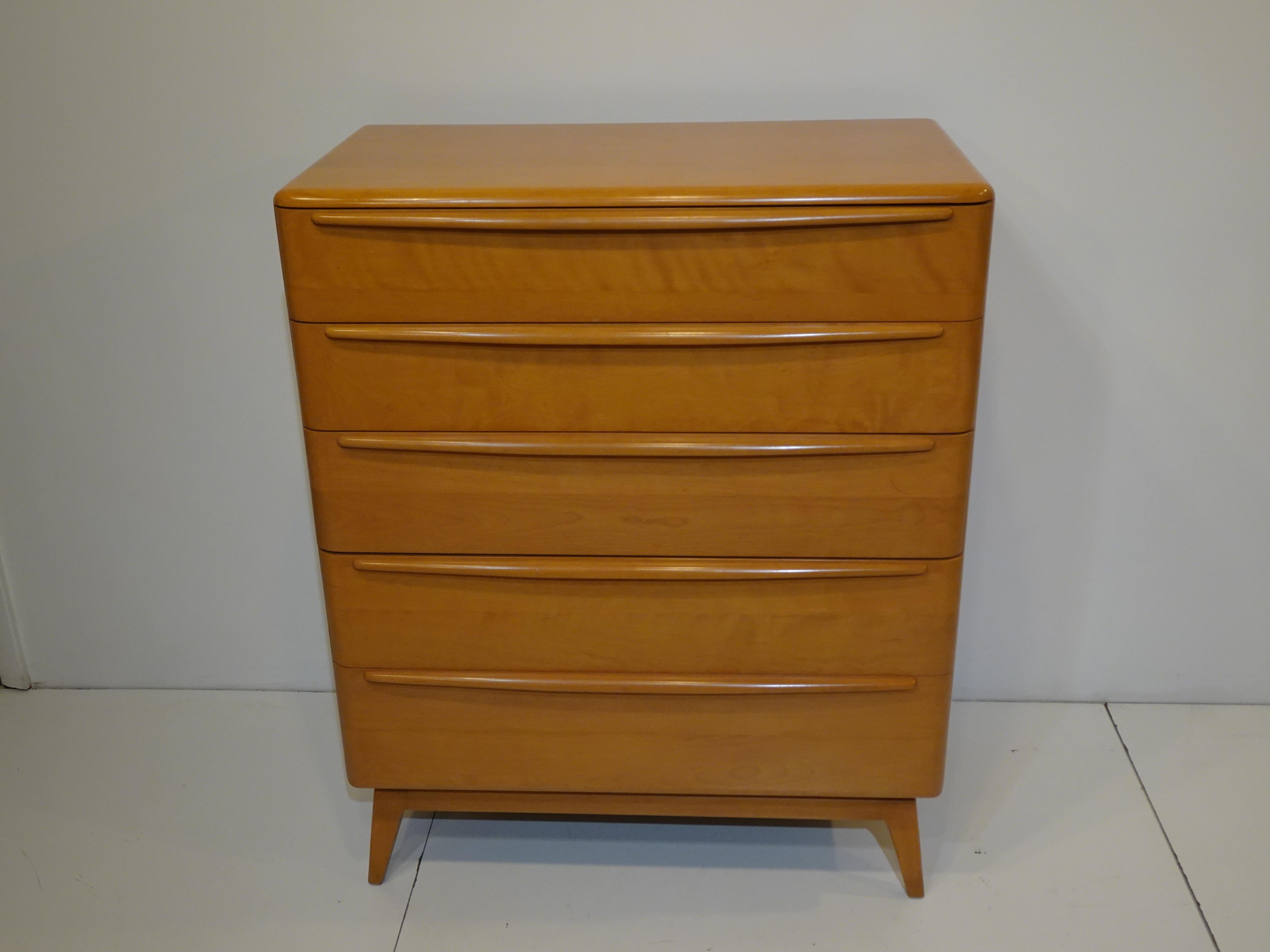 A well crafted solid wood five drawer mid century dresser chest with it's original beautiful Champagne finish. From the Encore collection this piece has the nicely tapered legs and lifted base making the piece feel light and airy. The drawer fronts