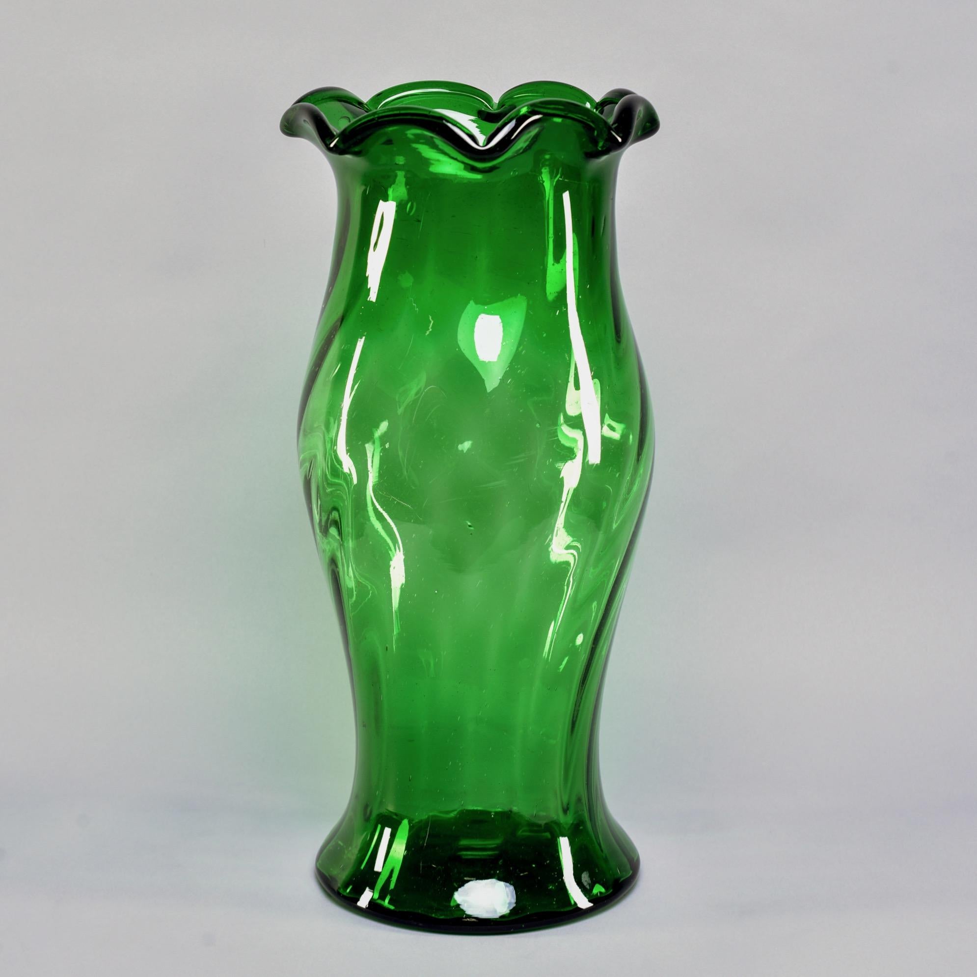 Tall green art glass vase found in Belgium with fluted top, circa 1950s. Stands 21