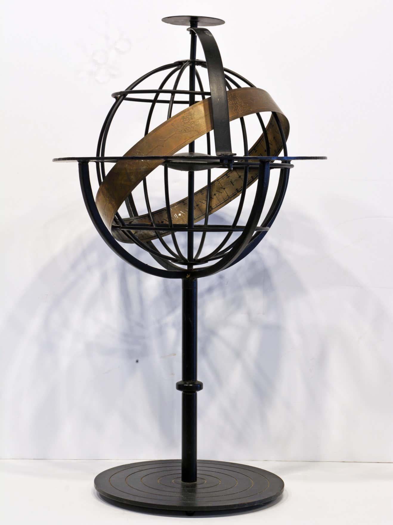 Standing 30 inches tall and designed in the 'form follows function' way this sphere or globe has a great aesthetic presence as a sculpture and without doubt a function for people interested in astrology and astronomy. Constructed of black painted