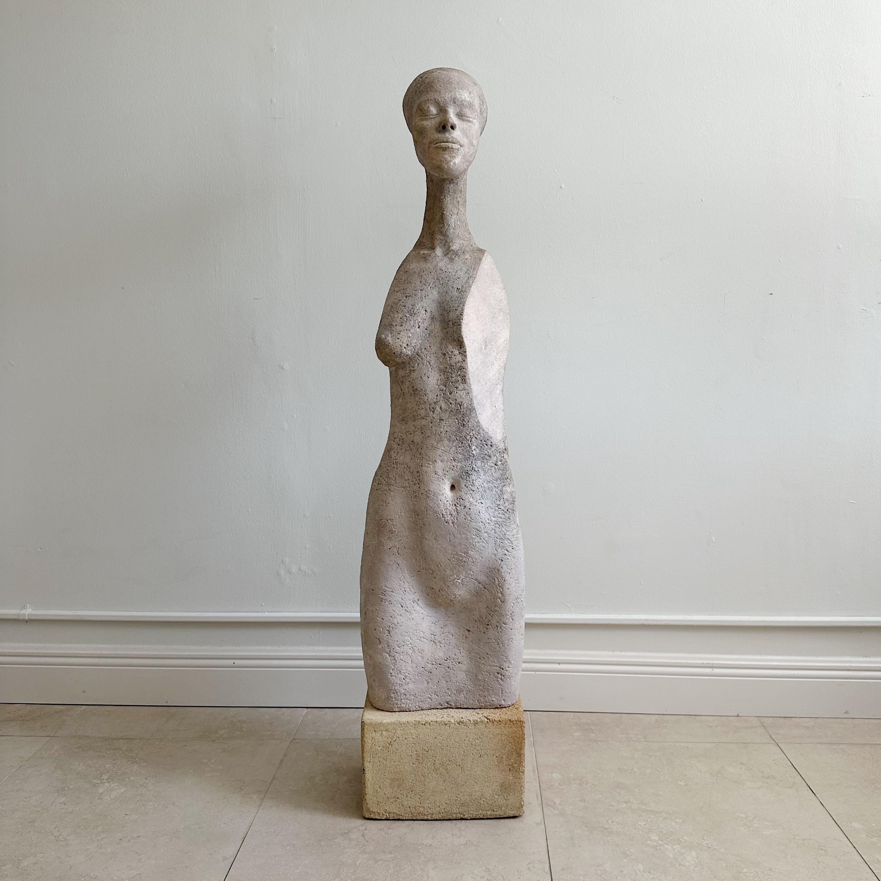 Tall Mid Century Nude Concrete Sculpture
A vintage concrete sculpture depicting a nude woman, showcasing evident signs of age and patina, which add to its weathered and antique appearance.