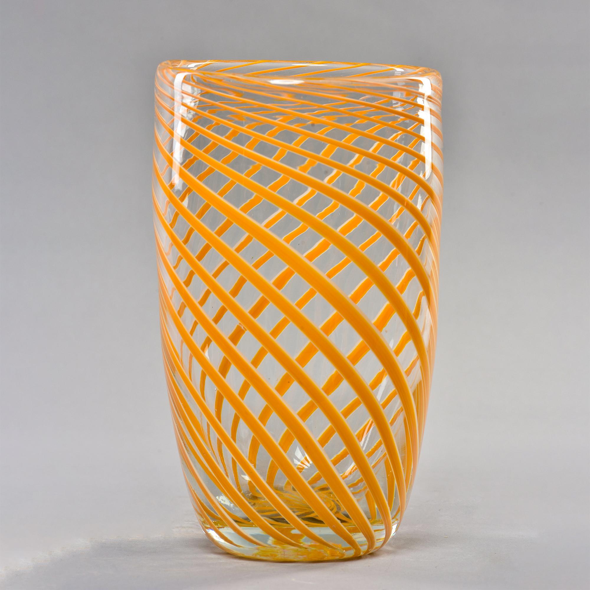 Circa 1970s murano vase in clear glass with orange spiral stripe. Unknown Murano maker. Very good vintage condition with minor scattered surface wear - no damage found.