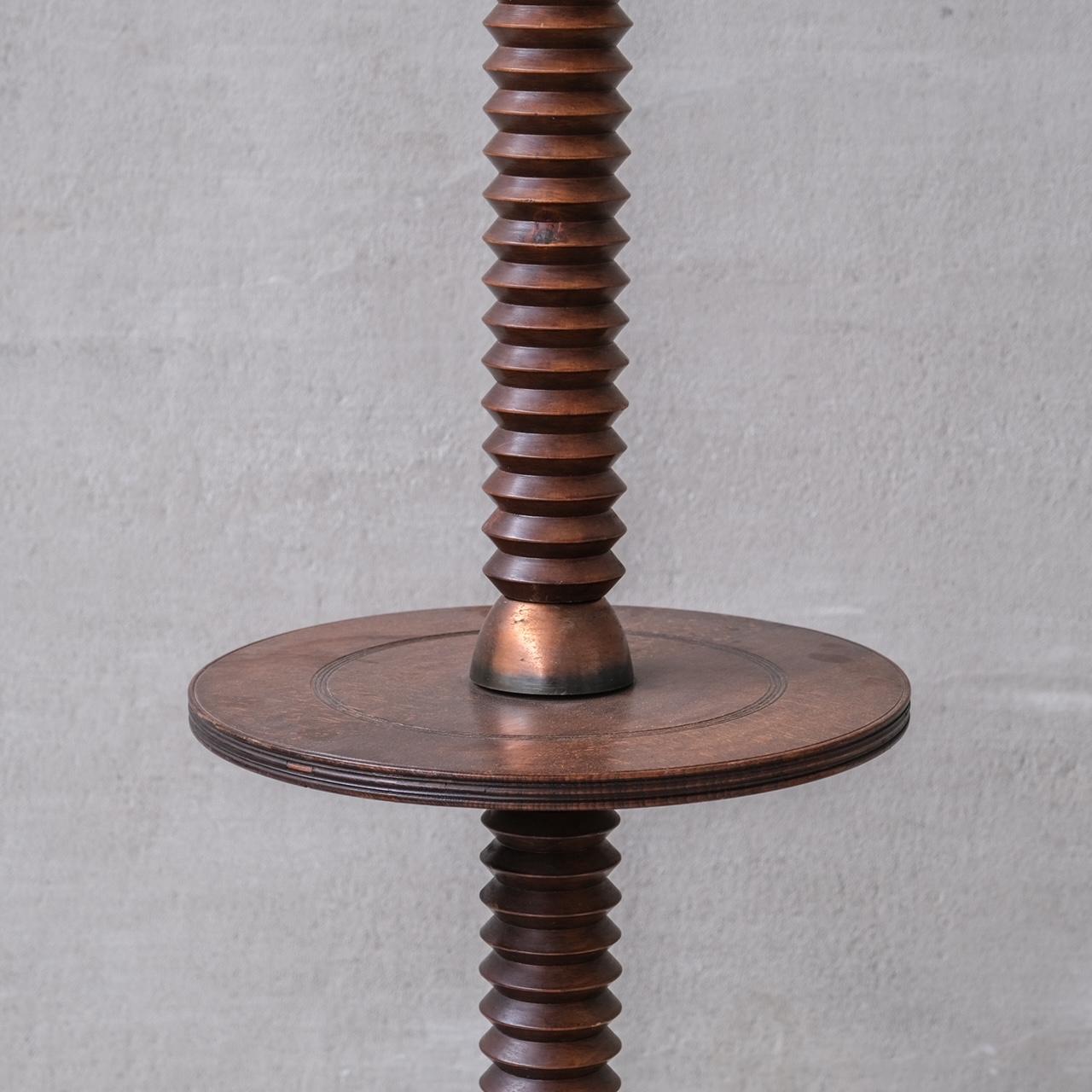 A tall turned oak floor lamp with copper detailing.

France, c1950s.

In the manner of Charles Dudouyt.  

Since re-wired and PAT tested.

Good vintage condition, some scuffs and wear commensurate with age.

Internal Ref: 12/9/23/008.

Location: