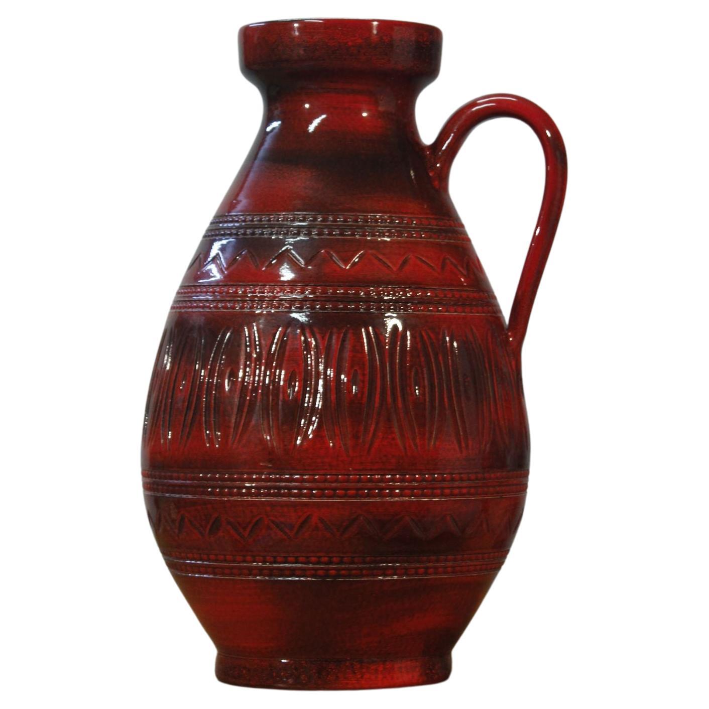 Tall mid-century West Germany ceramic deep red vase with handle For Sale