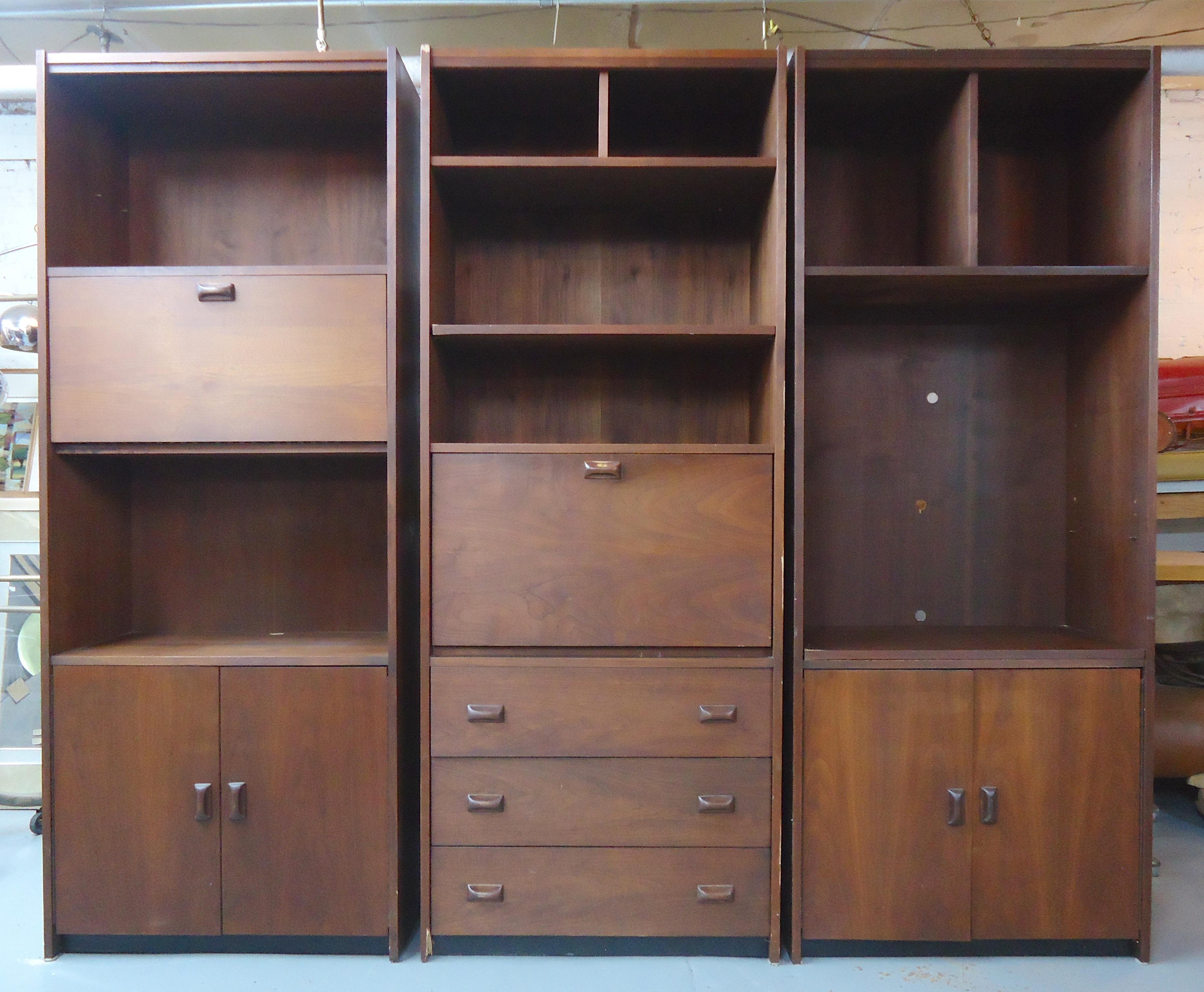 Mid-Century Modern walnut bookcase with cabinet storage. Part of a 3 piece unit.

(Please confirm item location - NY or NJ - with dealer).
 