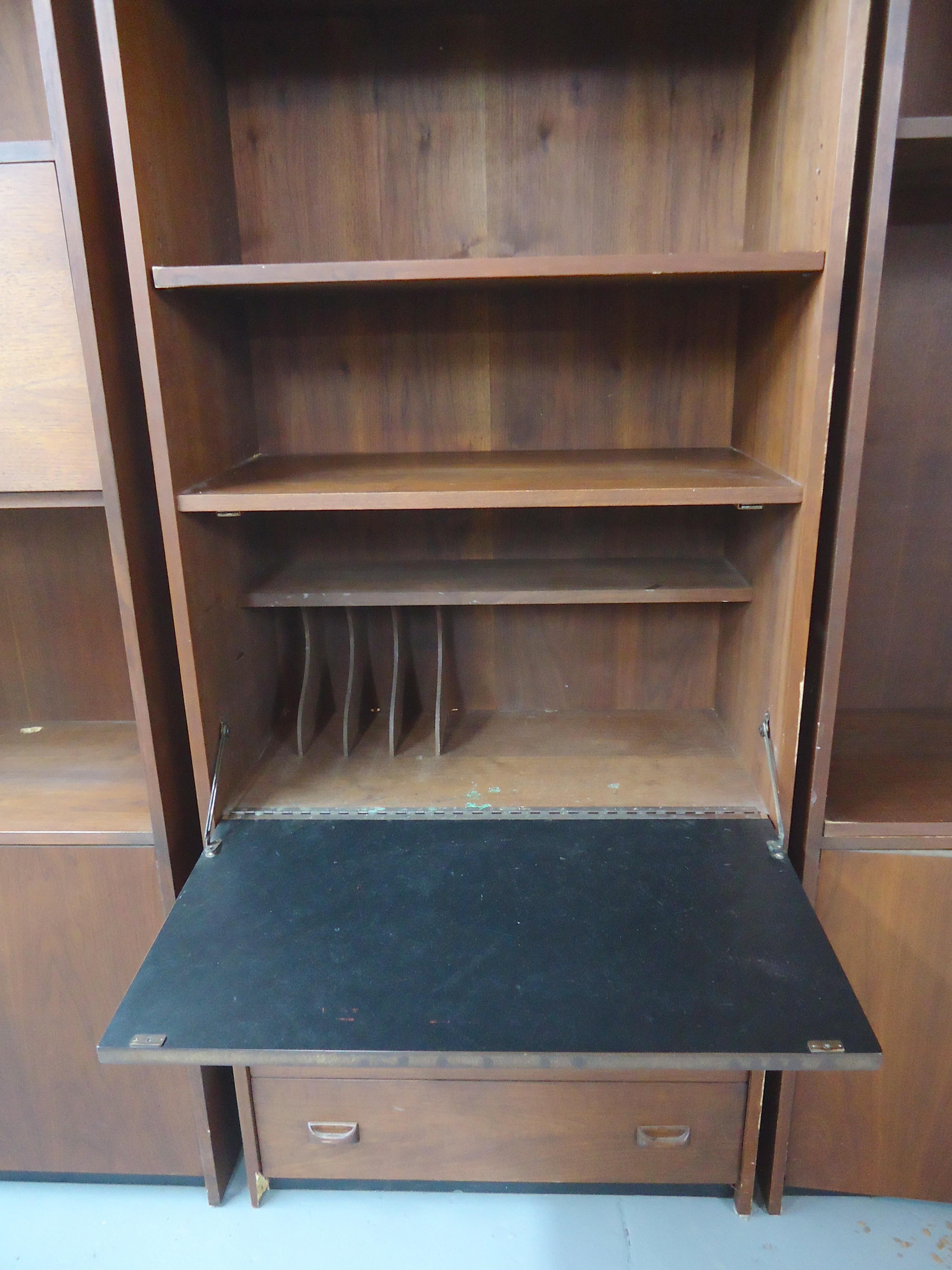 Mid-Century Modern bookcase with drawer storage and fold down desk/cabinet.
Part of a 3 piece unit.

(Please confirm item location - NY or NJ - with dealer).
 