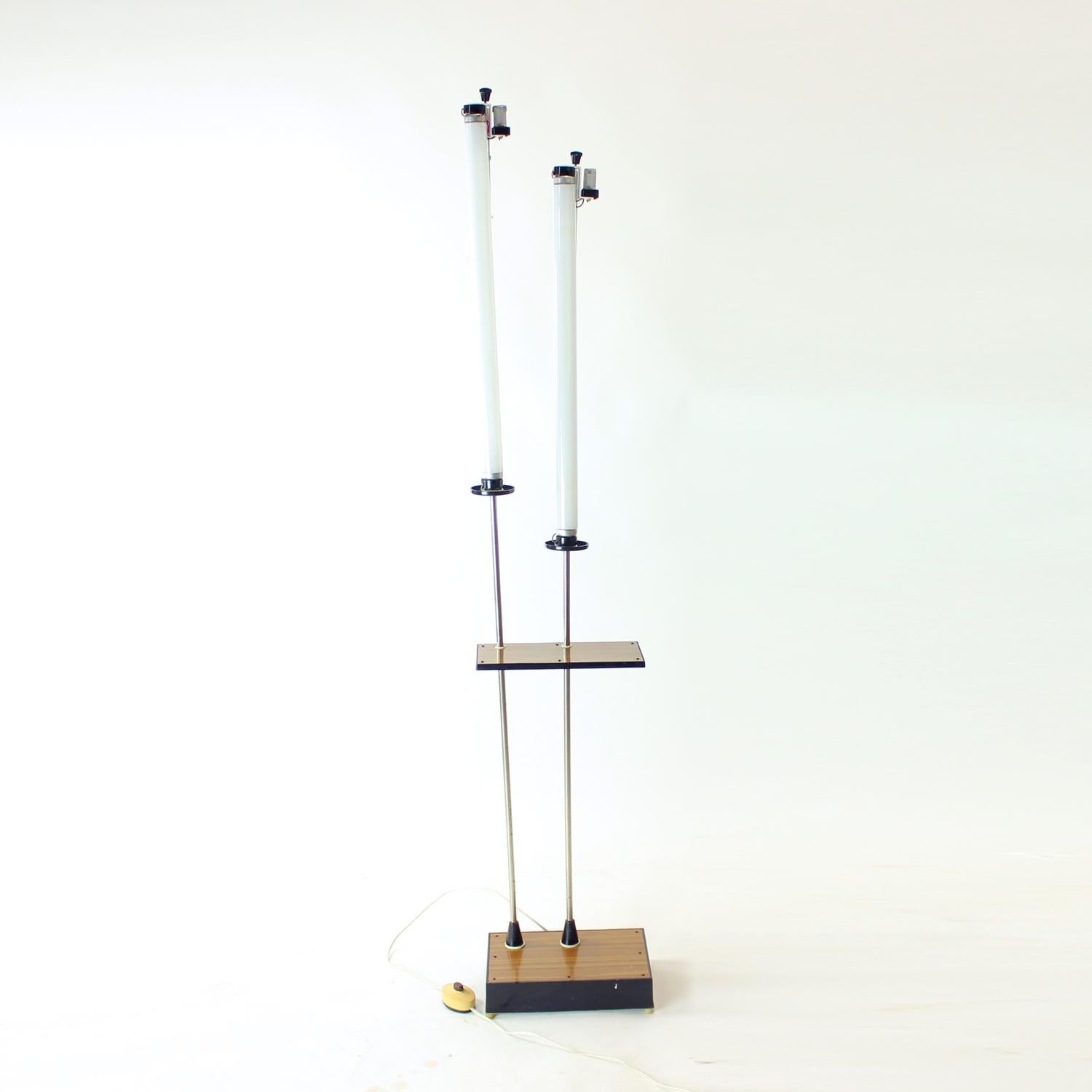 This is a unique freestanding floor light. Origining in Soviet Russia, the light was exported and used in Czechoslovakia during the Communist period in 1960s. Original label still attached. The light stands on a strong base which holds two lights,