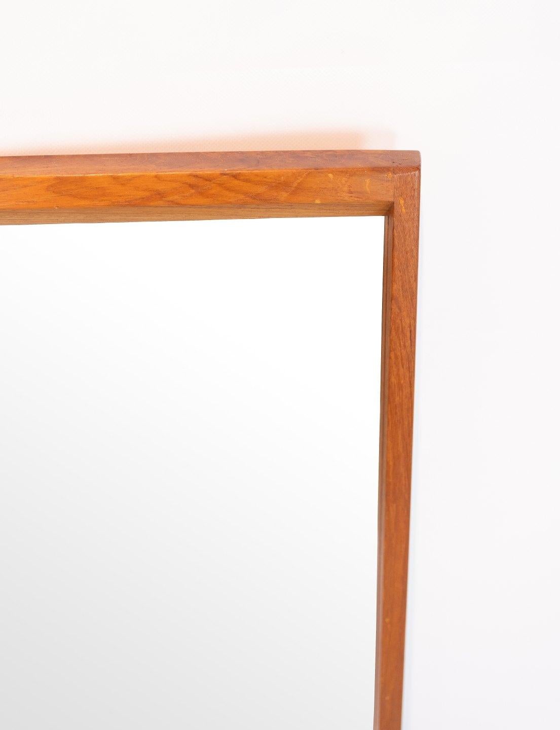 The tall mirror frame crafted in oak showcases the timeless elegance of Danish design, attributed to the renowned designer Aksel Kjærsgaard during the 1960s.

Aksel Kjærsgaard, a prominent figure in mid-century Danish design, was celebrated for his