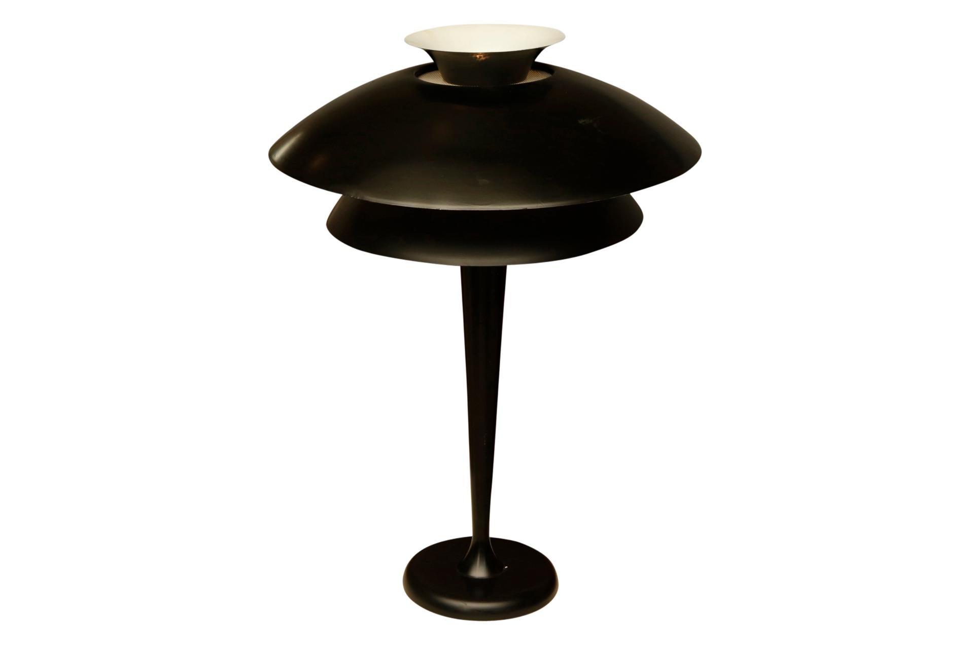 This Striking 29 inch tall lamp is created in 