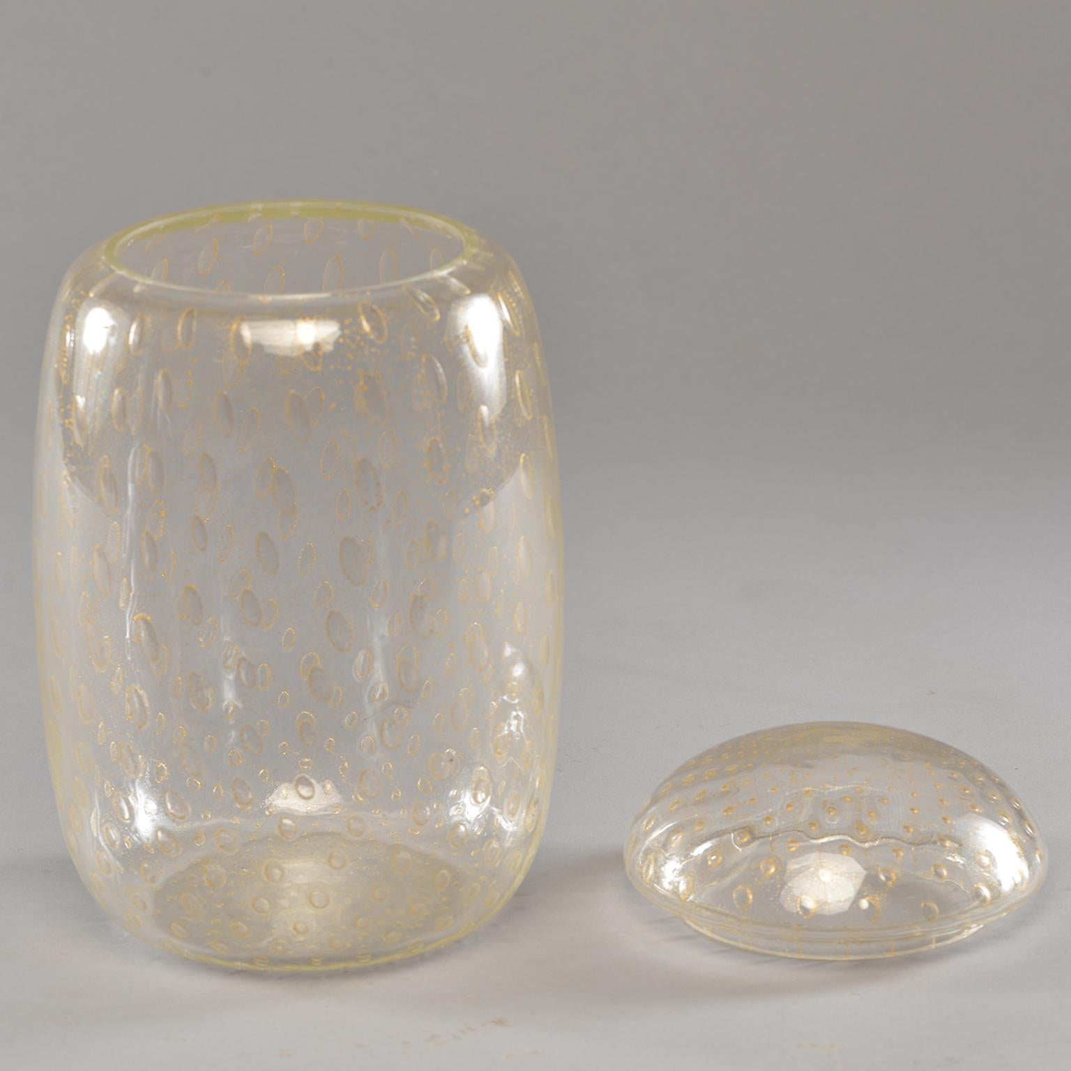 Tall Murano glass clear bubbled glass vessel with gold inclusions and dome-shaped lid, circa 1990s. Unknown maker. Excellent vintage condition with no flaws found.