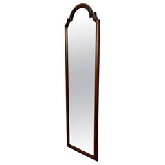 Tall narrow antique wooden scallop frame mirror. France early, 20th century.e