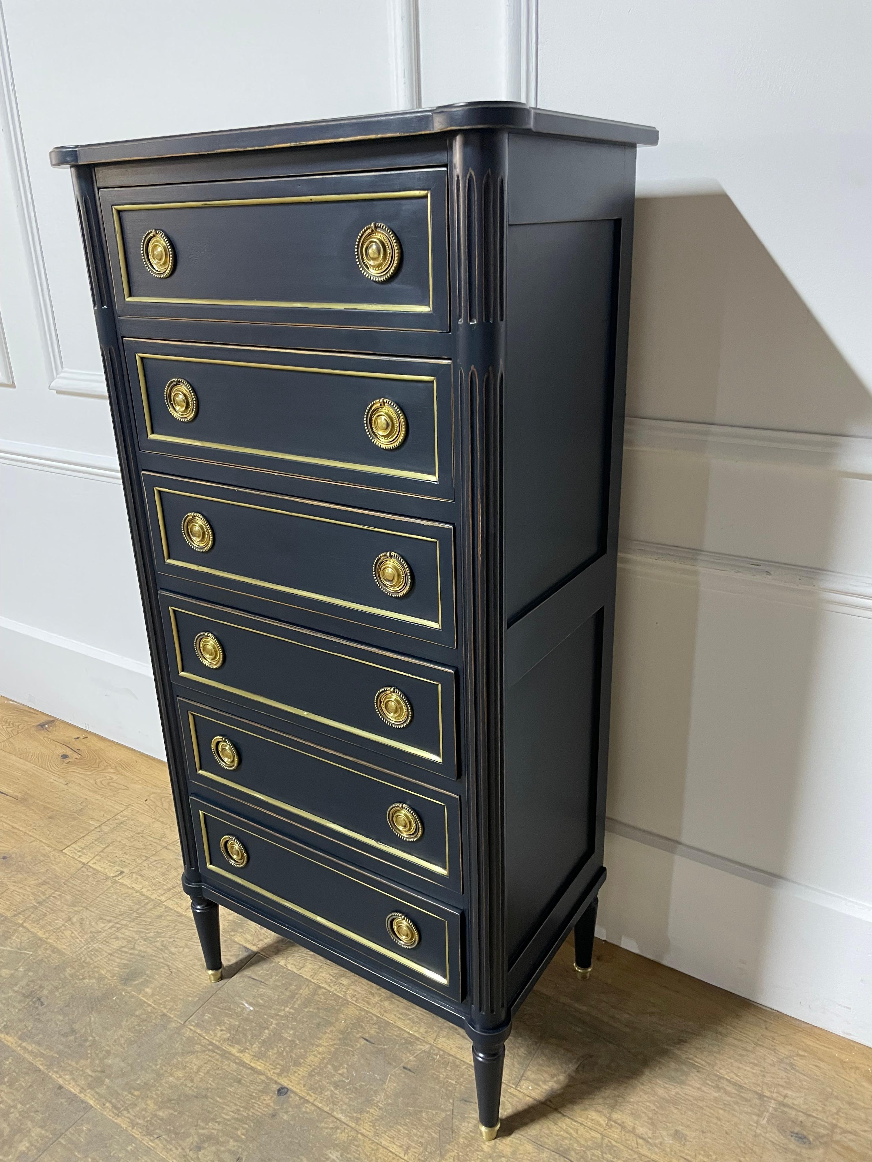 Very stylish early 20th century tall narrow chest of drawers in the Louis XVI style 

French circa 1940’s with original brass work and having been painted in a dark blue to give it a more contemporary feel

 

Height 133 cms 

Width 66 cms 

Depth