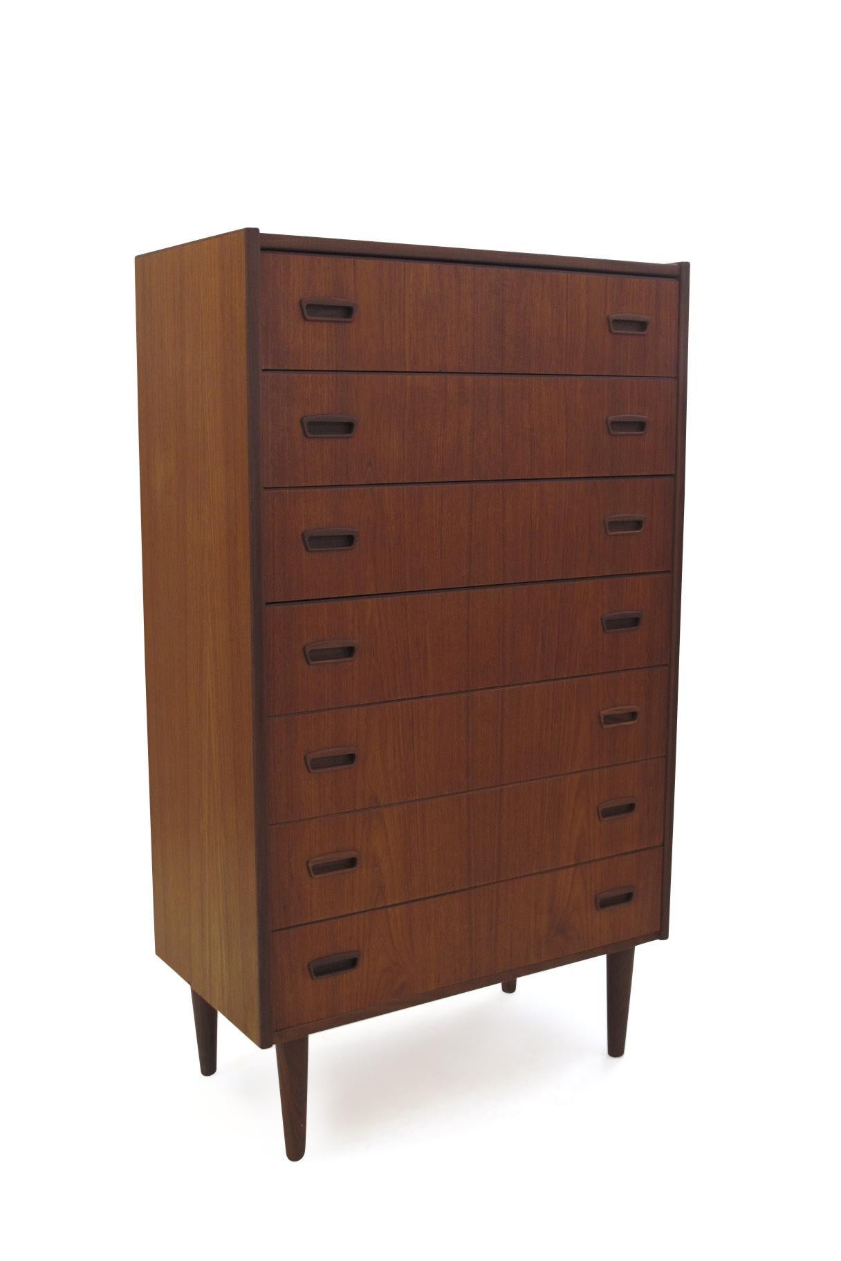Seven drawer teak dresser professionally restored and in excellent condition.