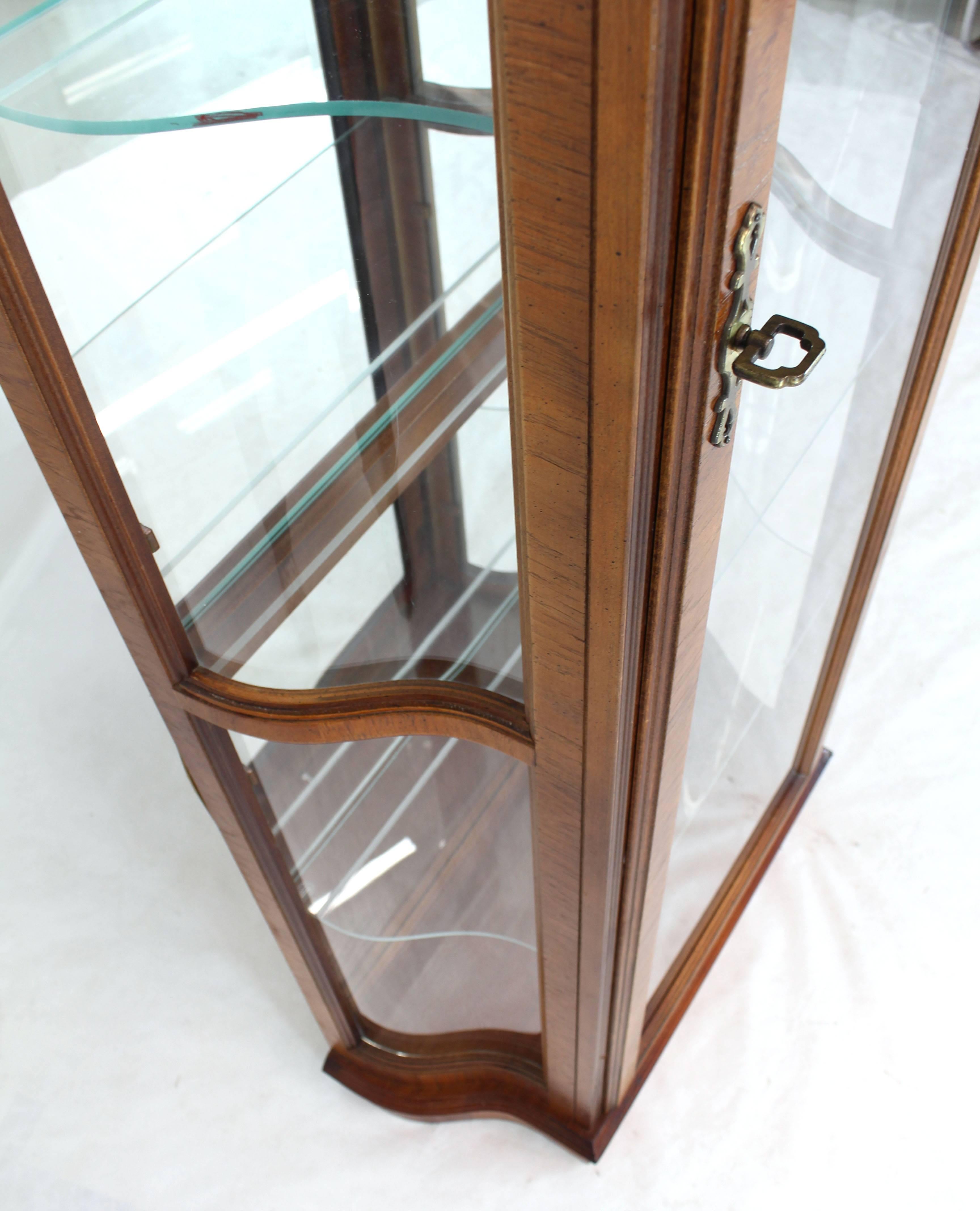 Very nice curved glass tall display curio cabinet with built in lights.