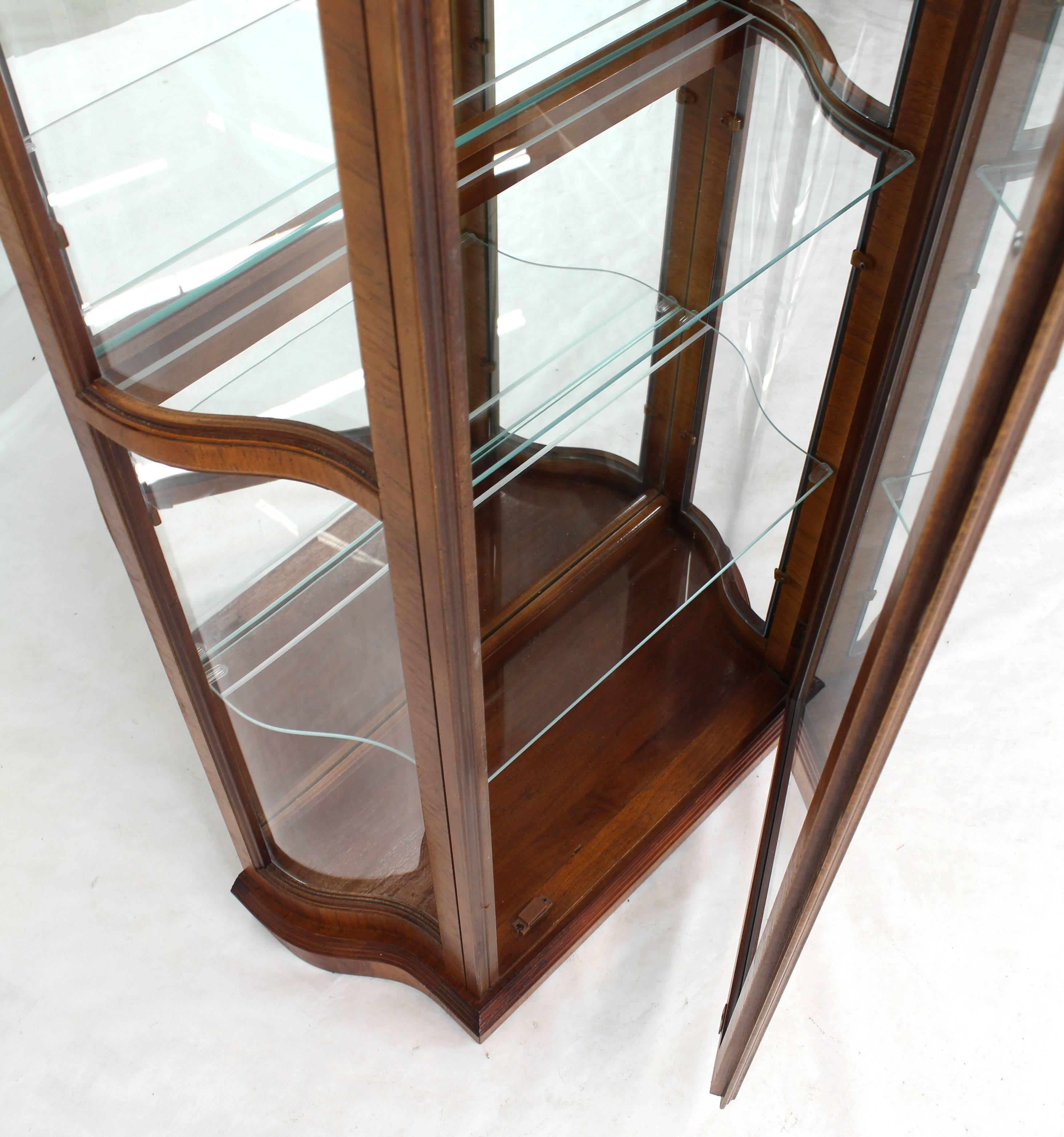 narrow curio cabinet with glass doors