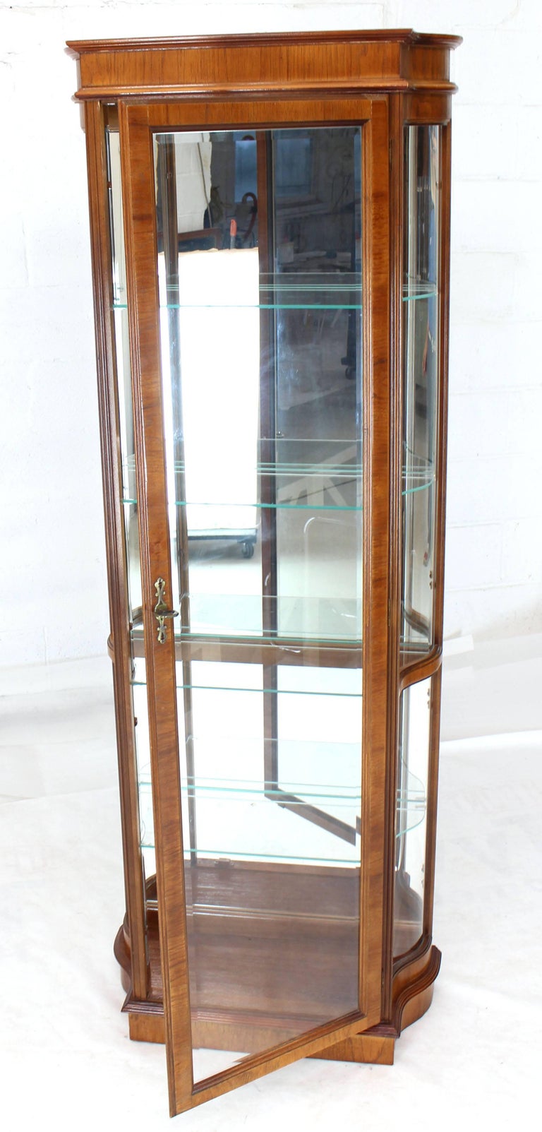 Tall Narrow Walnut and Mahogany Curved Glass Curio at 1stDibs