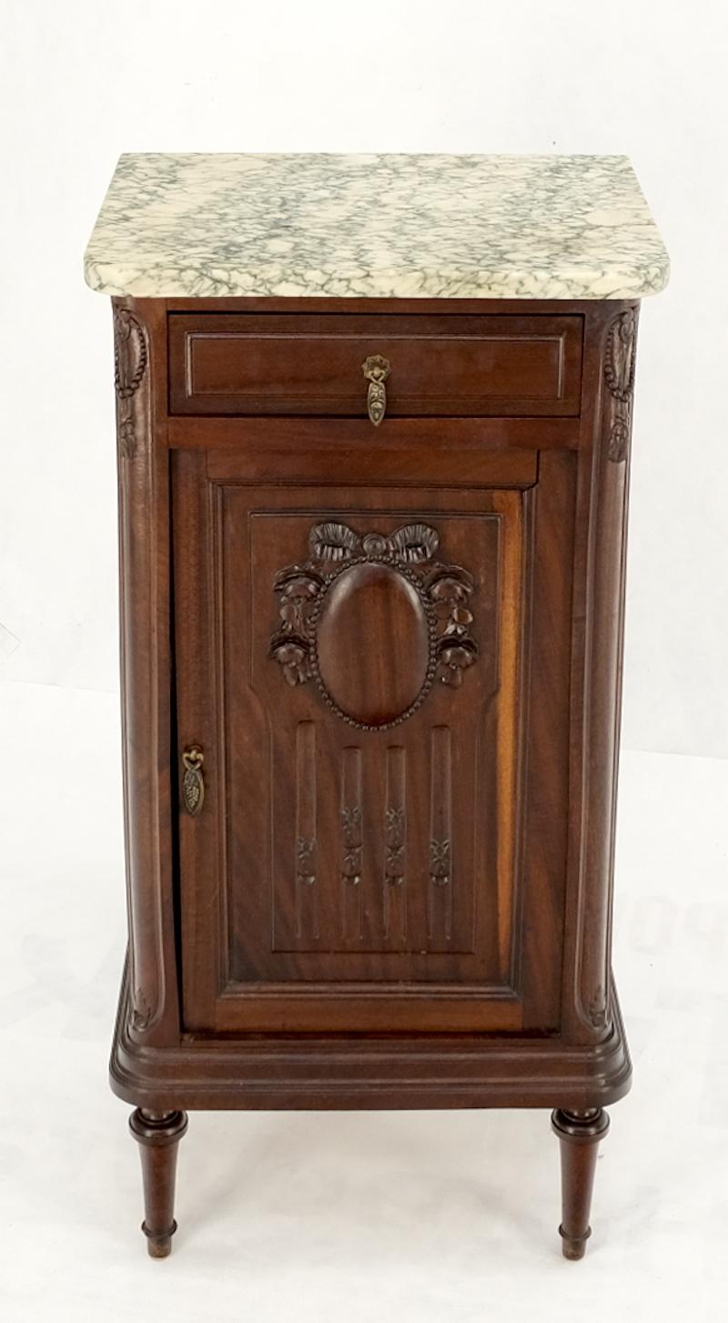 Tall narrow walnut marble top night stands end table cabinet porcelain insert.
Very fine walnut door panel decorative carving. Unusual porcelain insert lining compartment one top drawer marble top.