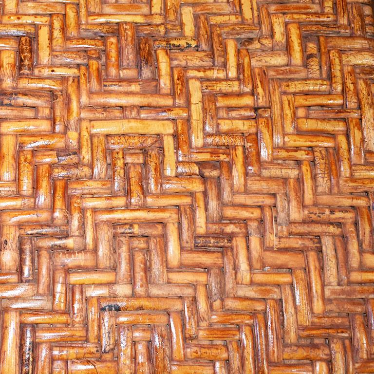 Every room needs a rattan or bamboo piece. It’s the classic timeless way to add a bit of warmth to any space. This piece is created from bamboo, bentwood and wicker. The top of the stand is made of woven rattan in a zigzag pattern. The body is