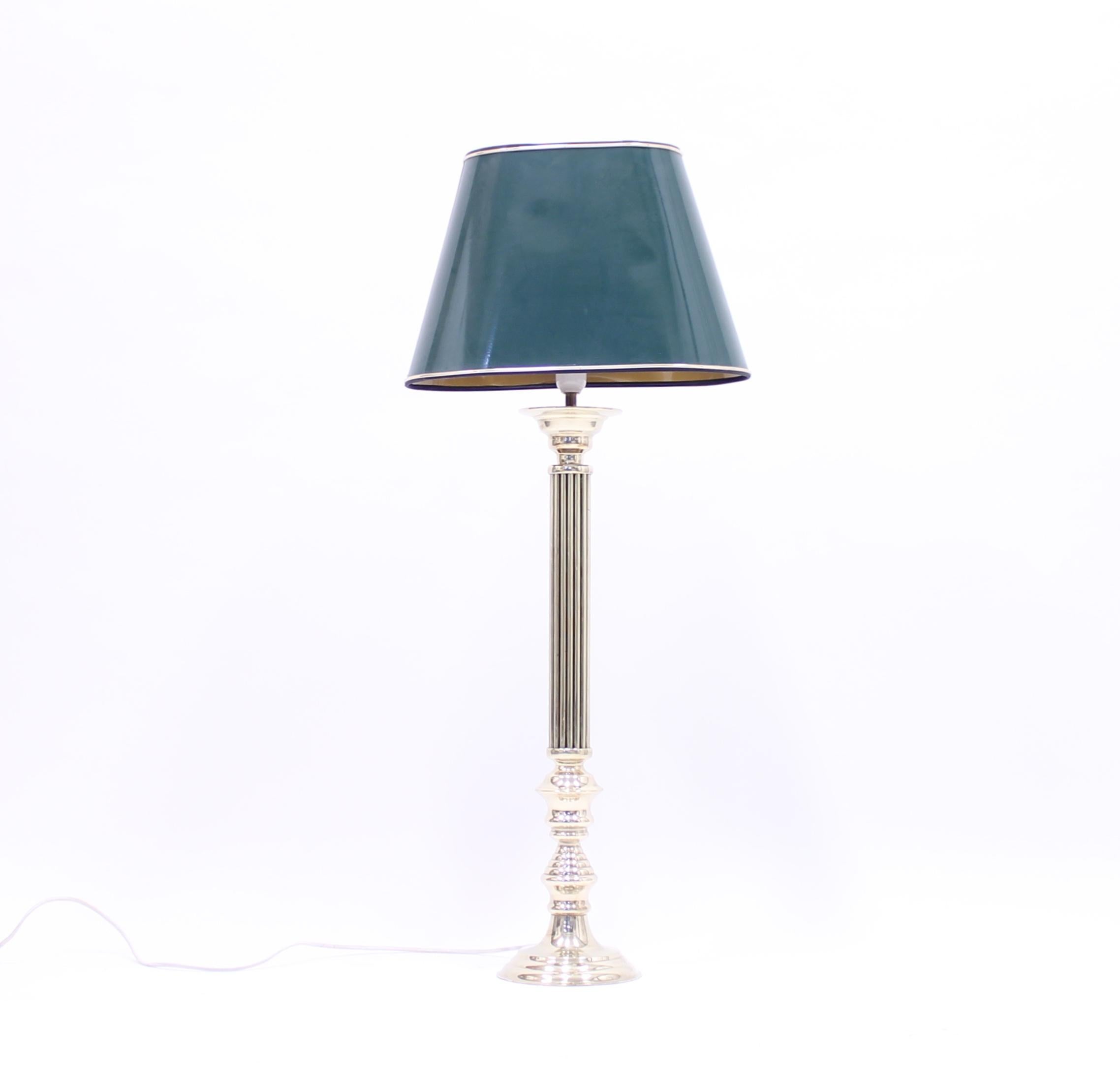 Tall brass table lamp in a neoclassical style with a green lacquered shade. Made in the 1970s. Most likely Swedish. Very good vintage condition with minor ware.
  