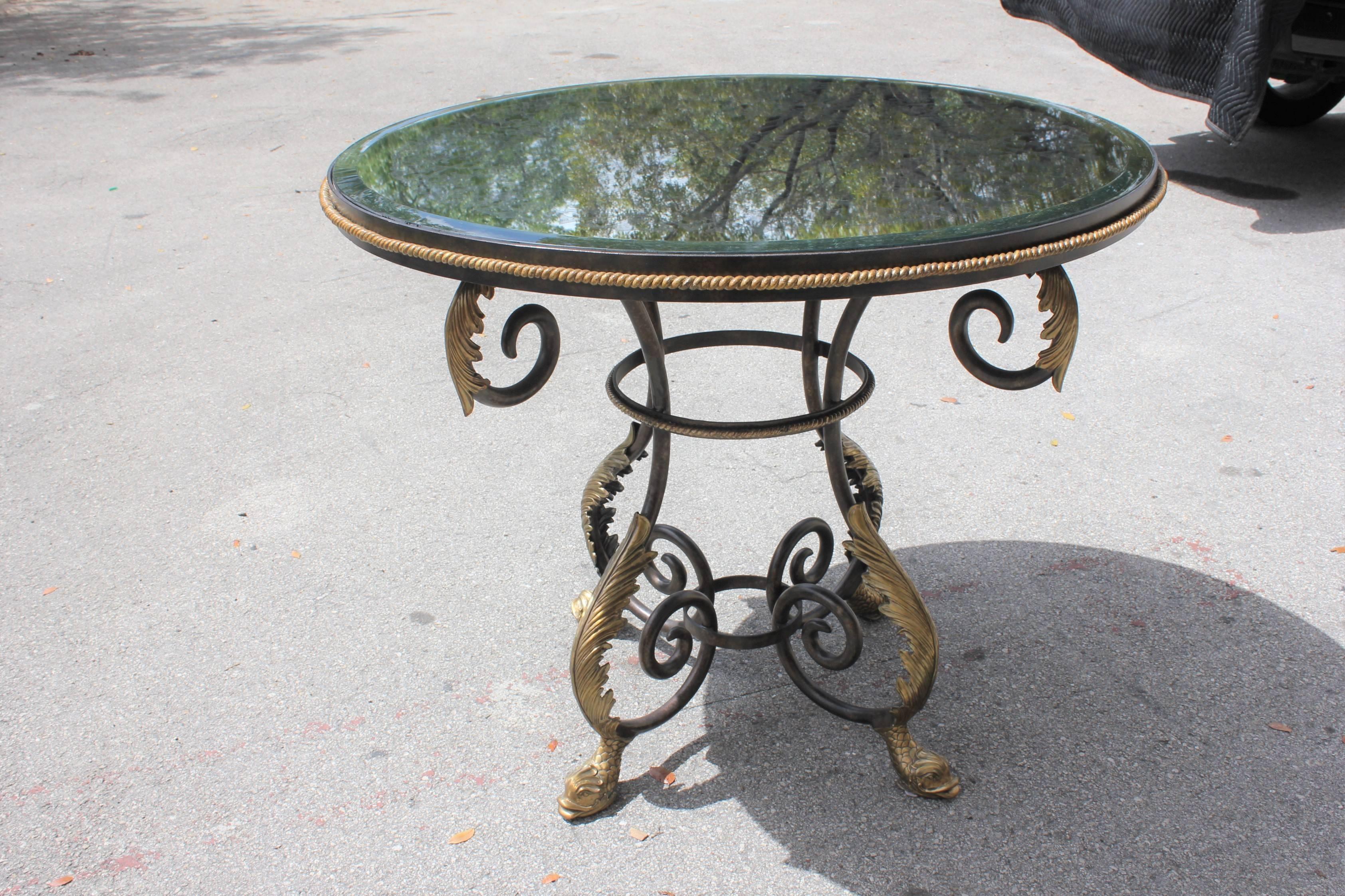 Fine neoclassical iron center table eglomise mirror top dolphins feet. The detail eglomise mirror top are spectacular, the all iron and bronze detail table are beautiful, this 4 solid bronze Dolphins feet are beautiful .the table and the glass are