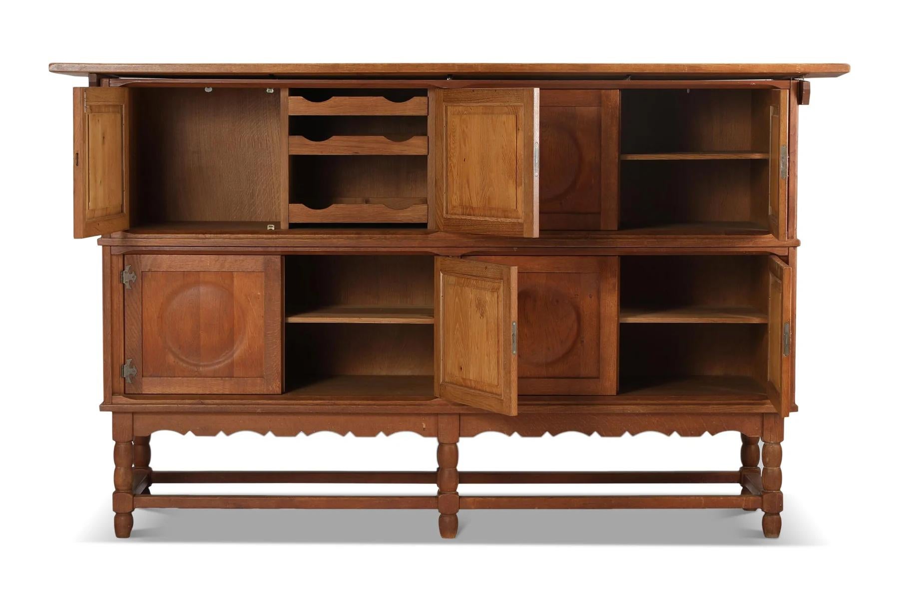 Mid-Century Modern Tall oak sideboard with eight circular doors by henry kjaernulf For Sale