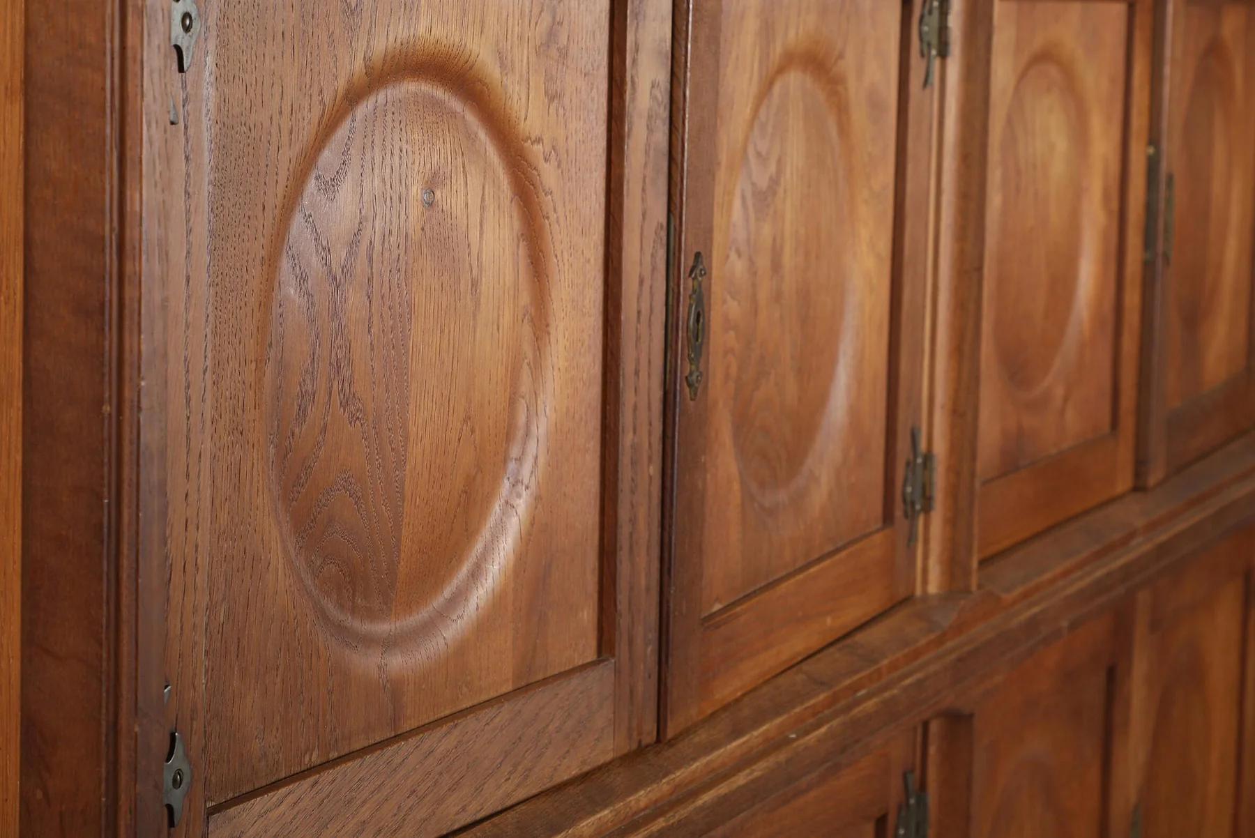 Danish Tall oak sideboard with eight circular doors by henry kjaernulf For Sale