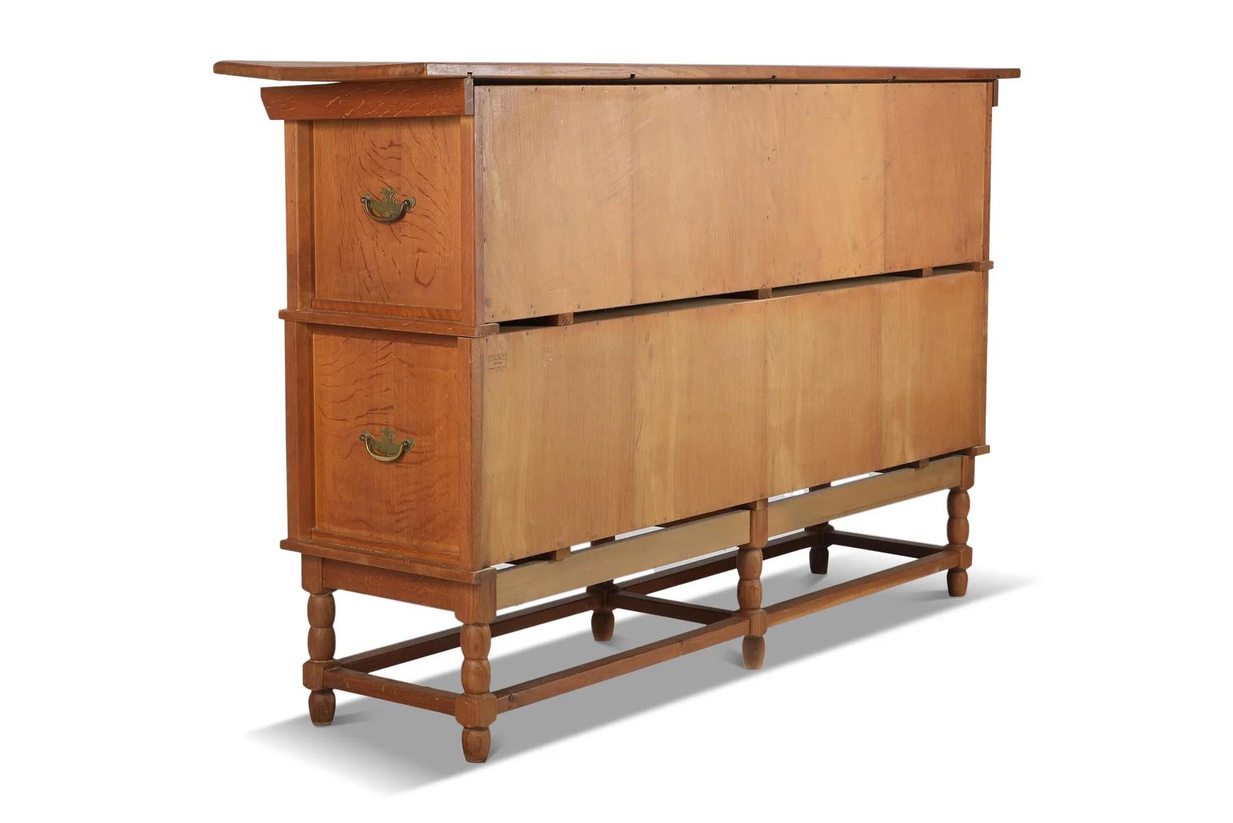 Tall oak sideboard with eight circular doors by henry kjaernulf In Good Condition For Sale In Berkeley, CA