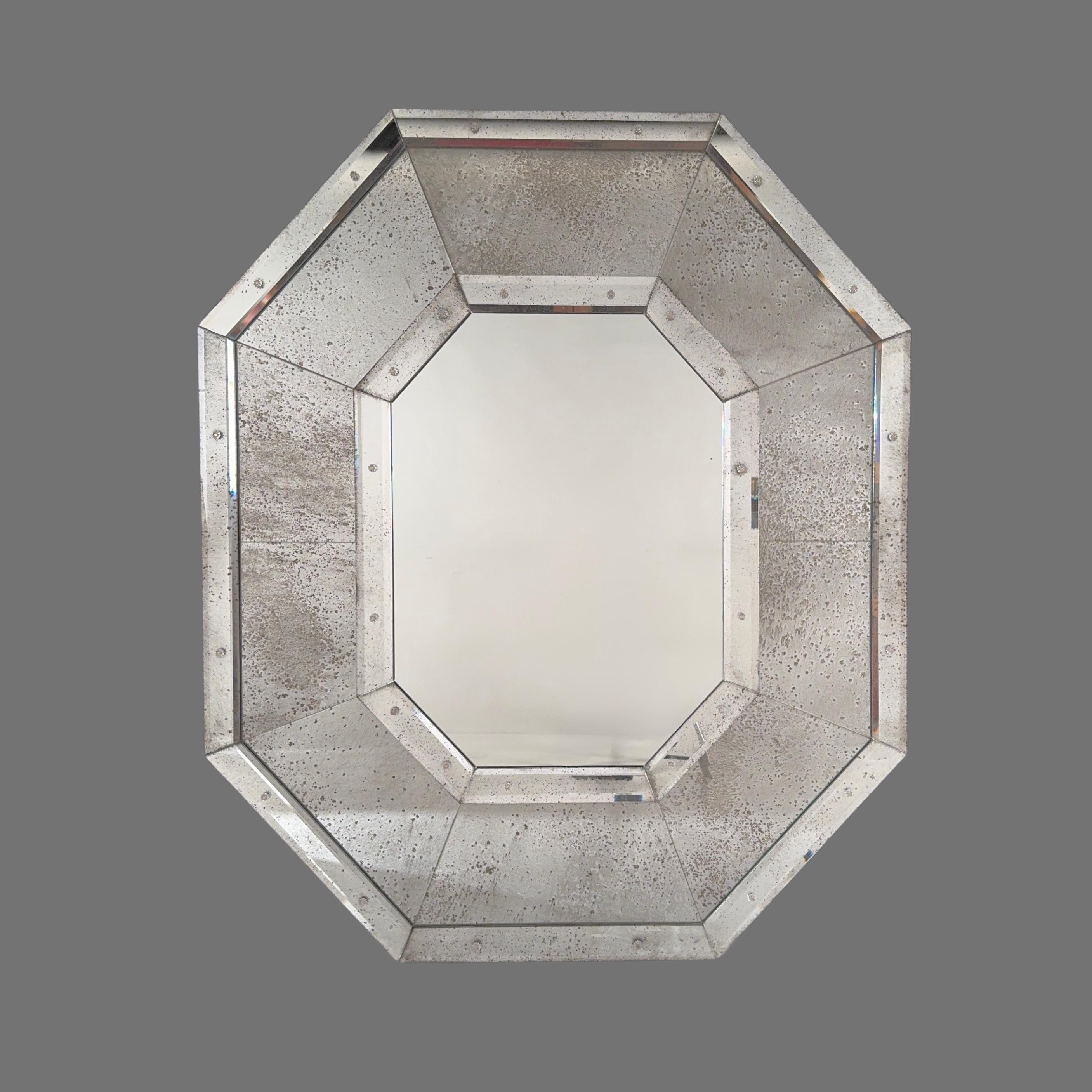 Tall Octogone™ mirror by Design Frères®.
The beauty is in the details: antiqued mirror, beveled glass, and rosettes.
Timeless Art Deco esthetic for the modern world.
Aluminum mounting bracket included.
