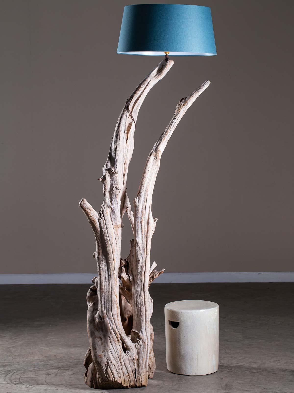 Super tall incredible organic modern driftwood floor lamp crafted entirely by nature. Harvested from the shores of Southeast Asia this one of a kind floor lamp exhibits all the natural signs of having been tumbled in the ocean. The play of light and